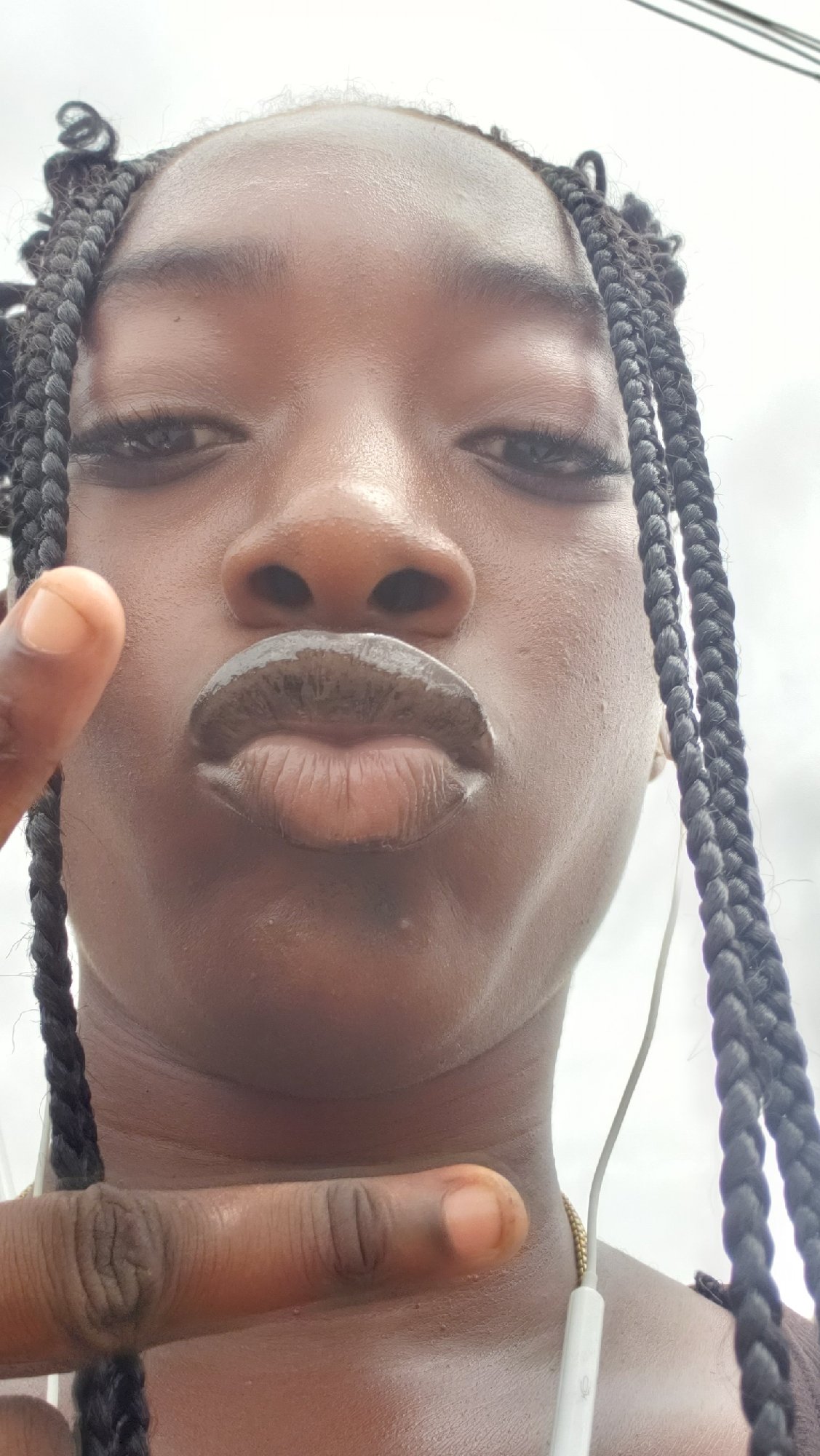 Woman takes selfie, street photos in Rido Nigeria