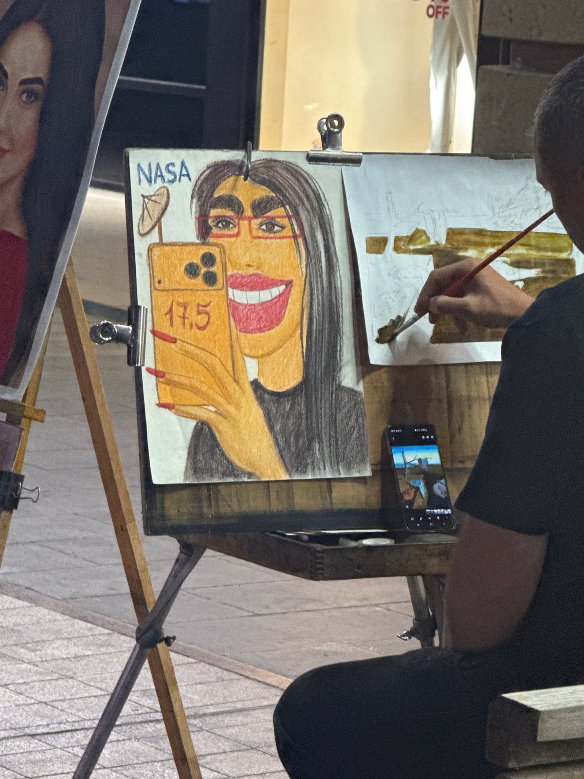 Artists work indoors and outdoors during evening hours