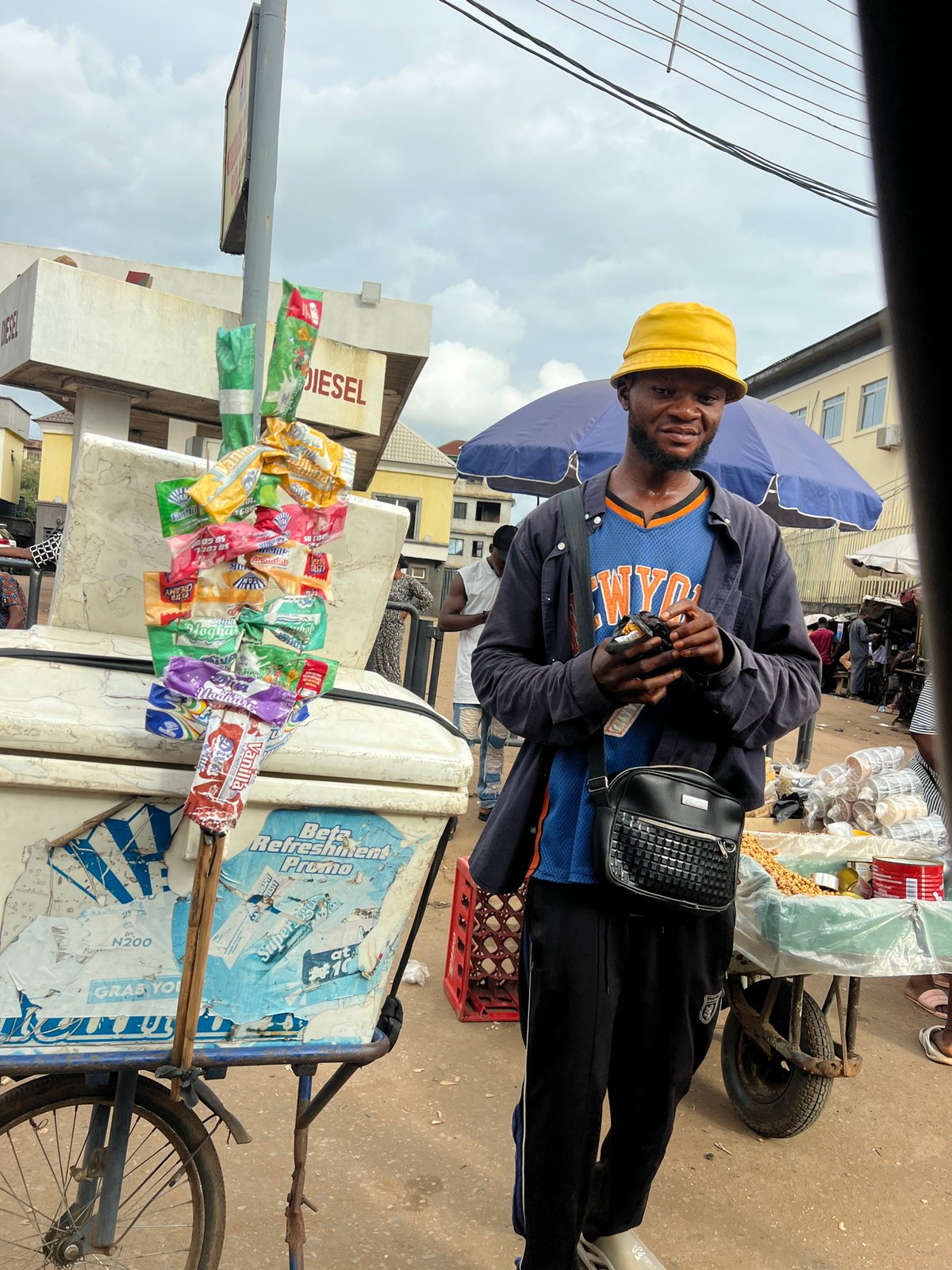 Street life and vendors at a Nkpor, Nigeria corner