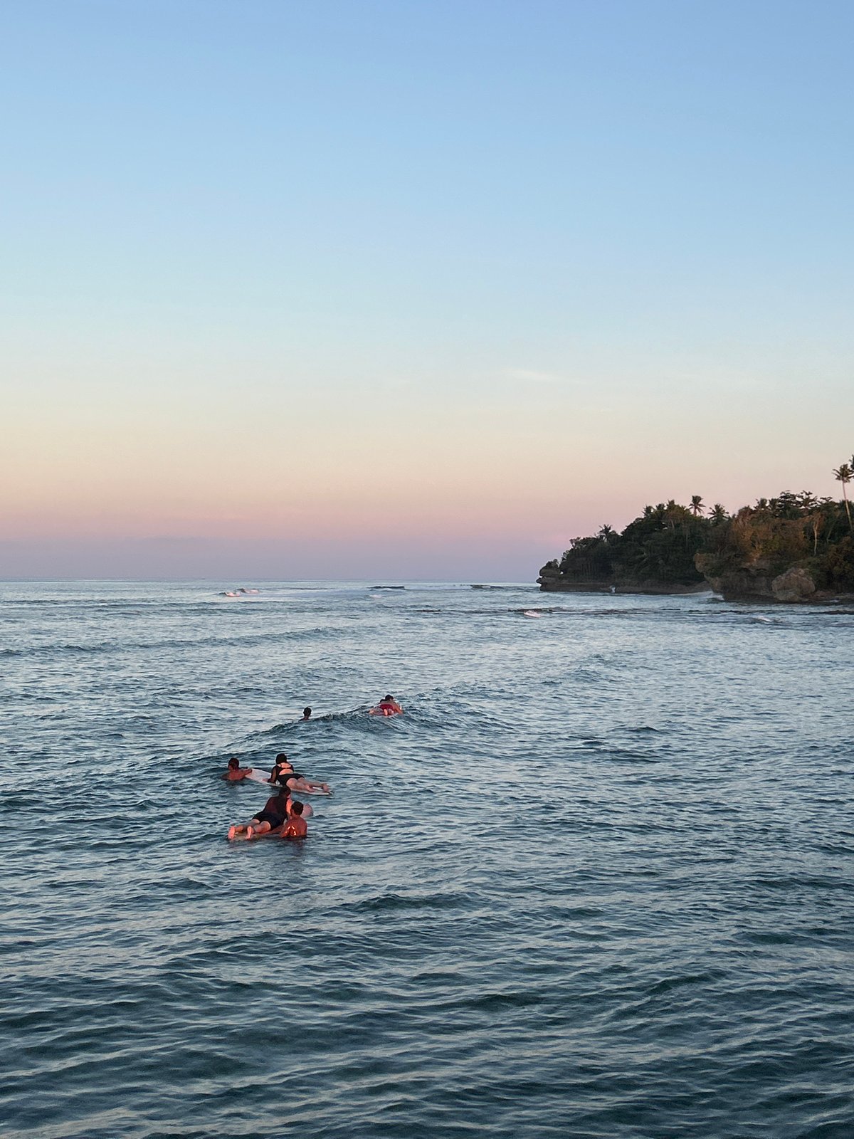 Sunset surfing session draws crowds to General Luna beaches