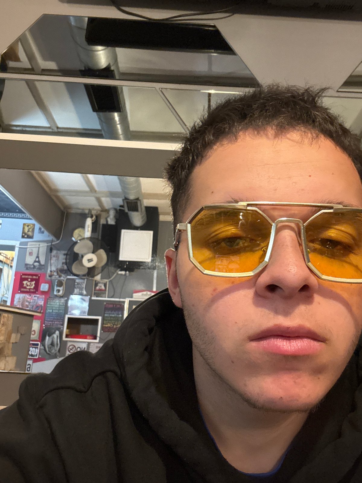 Man takes selfies indoors in Kostinbrod, Bulgaria