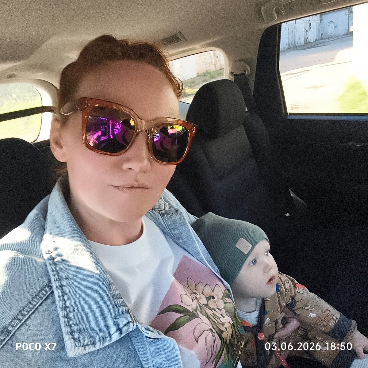 Woman and toddler captured during afternoon car journey