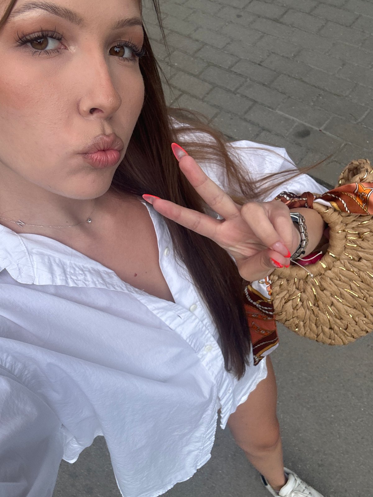 Playful selfies on a Varna brick plaza, summer afternoon