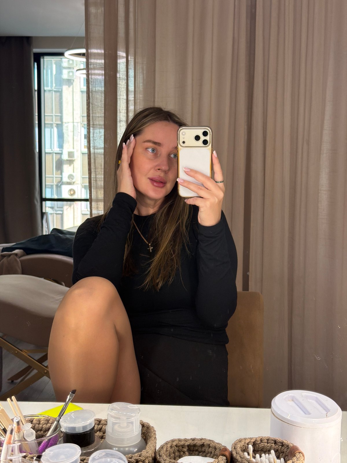 Woman takes selfies in Moscow beauty setting and elevator