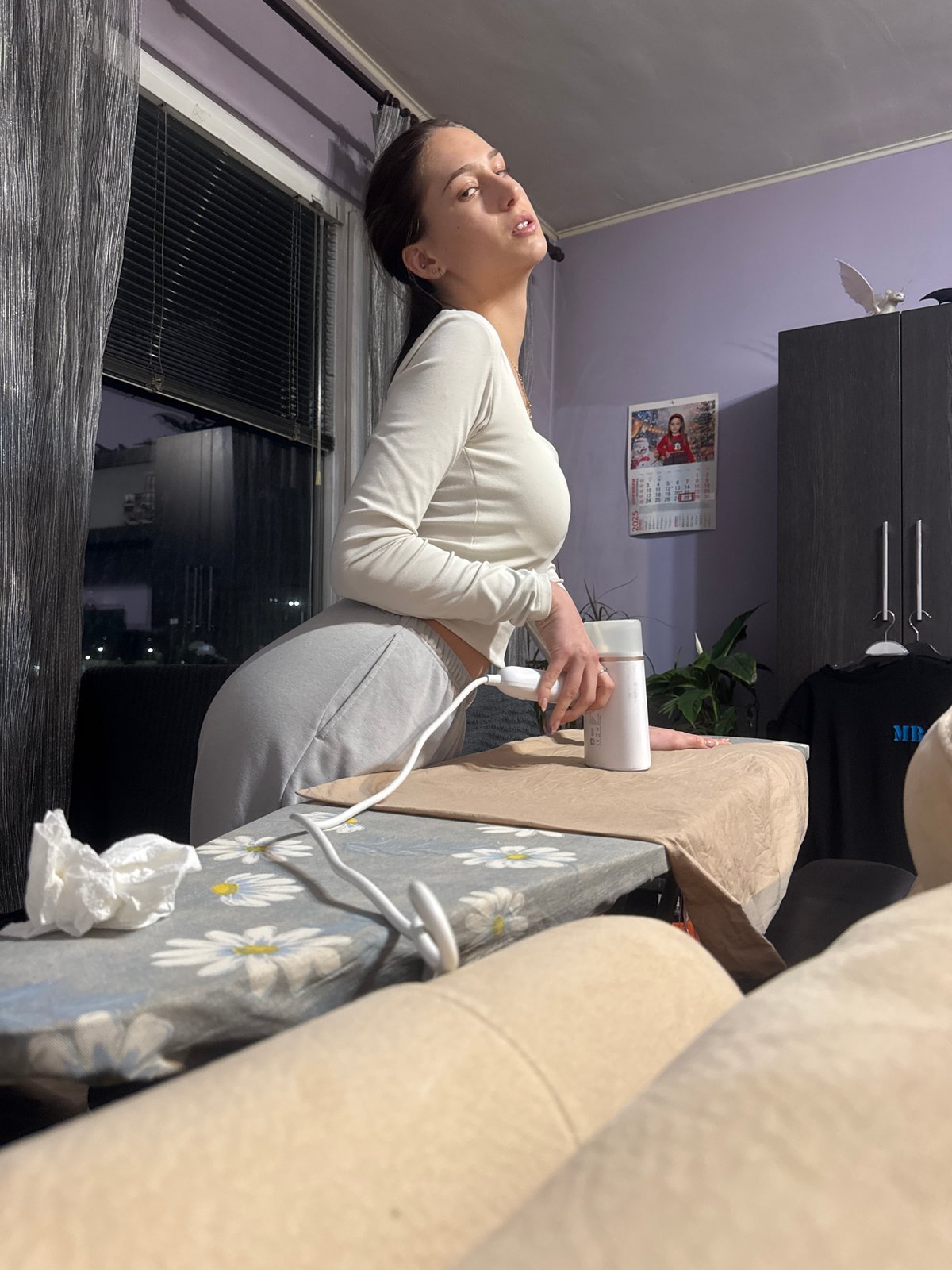 Two women relax on sofa in Sofia apartment