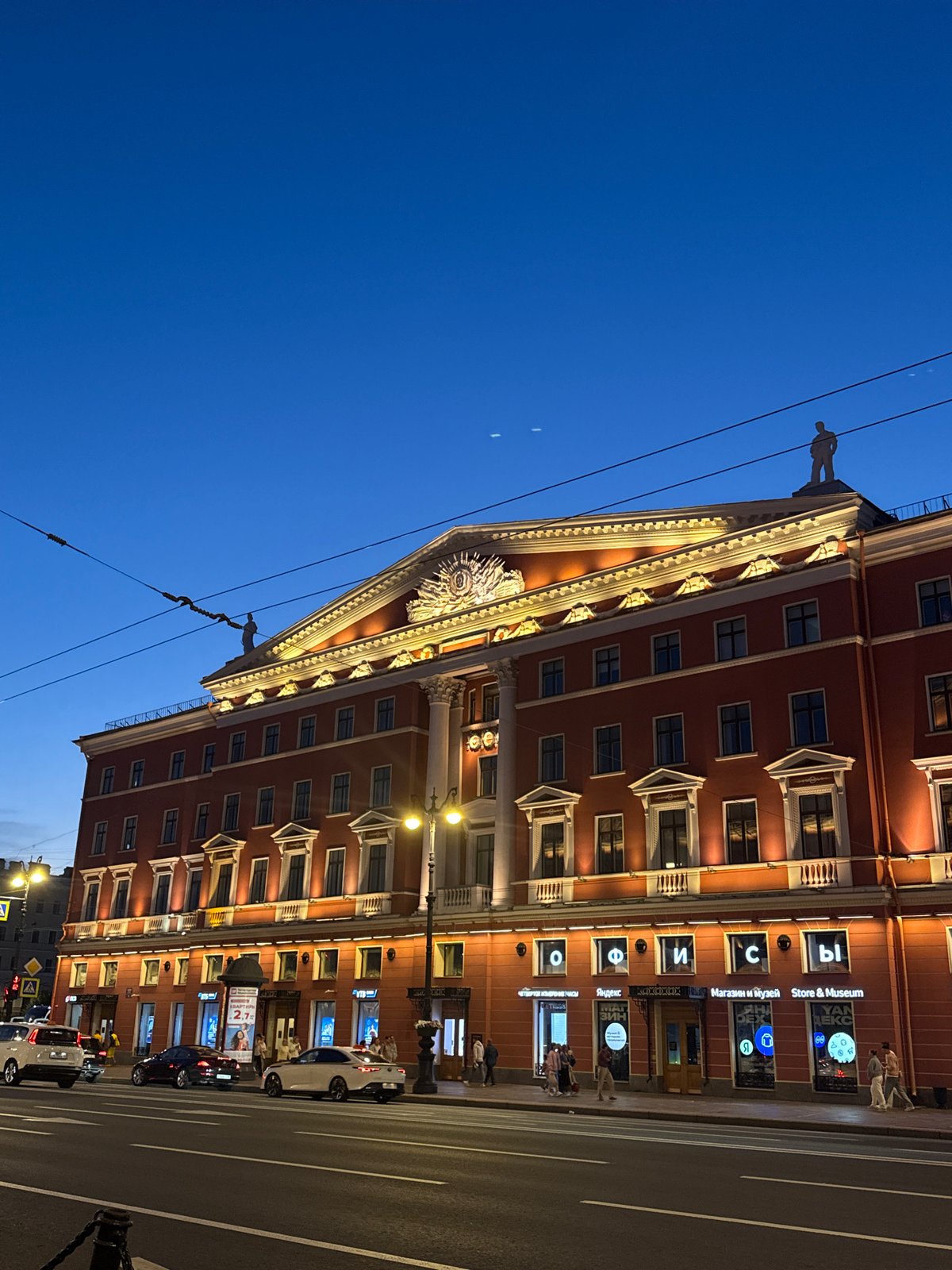 Dusk on a Saint Petersburg street: architecture and a lit pub entrance