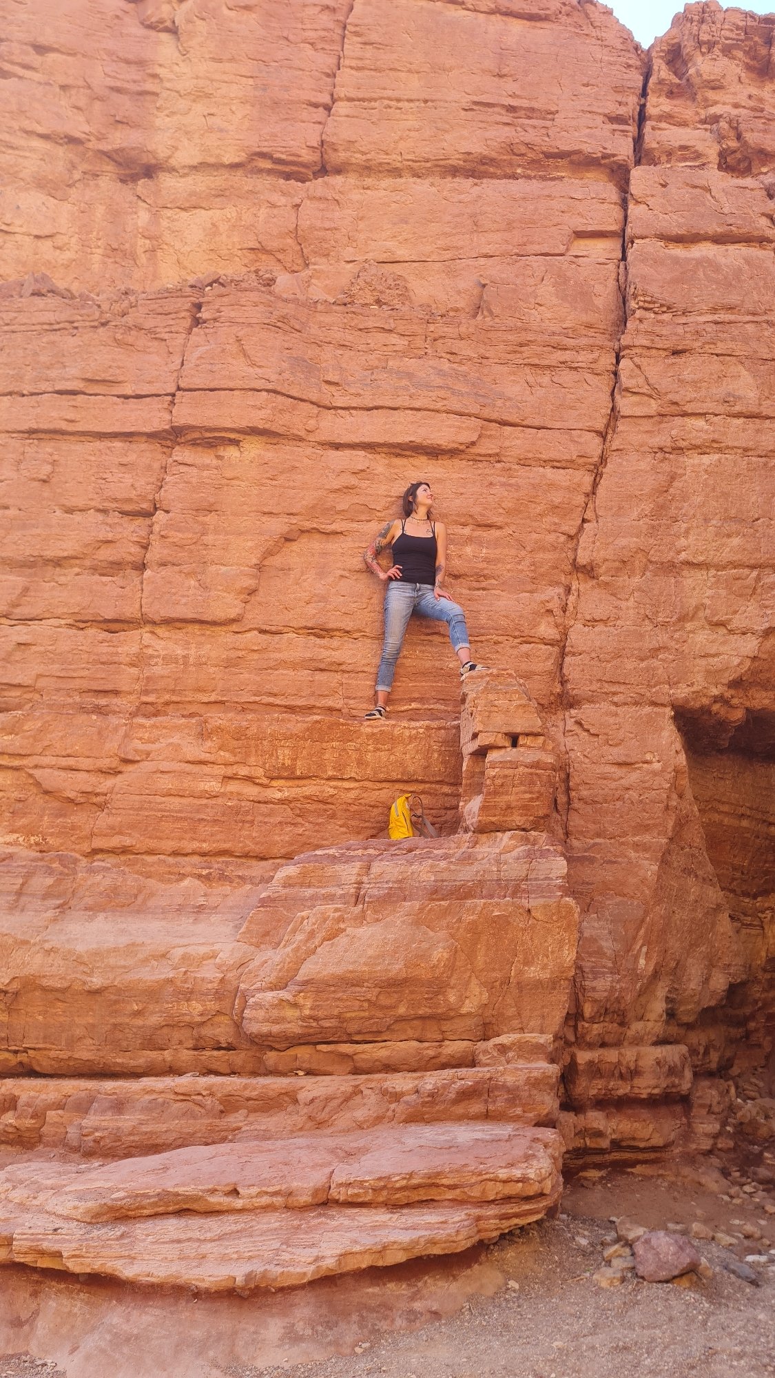 Woman explores desert canyons in southern Israel before dawn