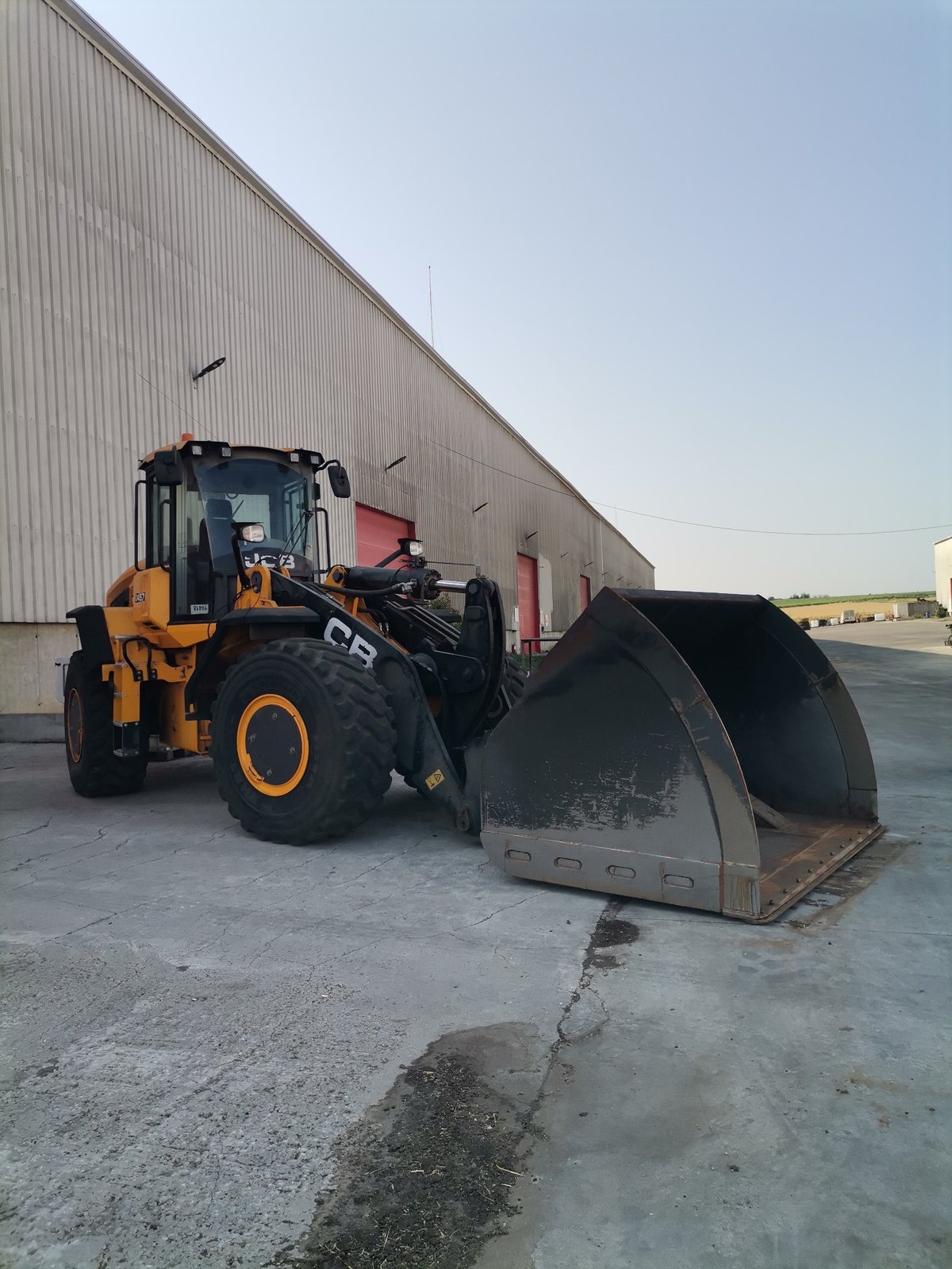 Industrial yard activity in Slanchevo with heavy vehicles and equipment
