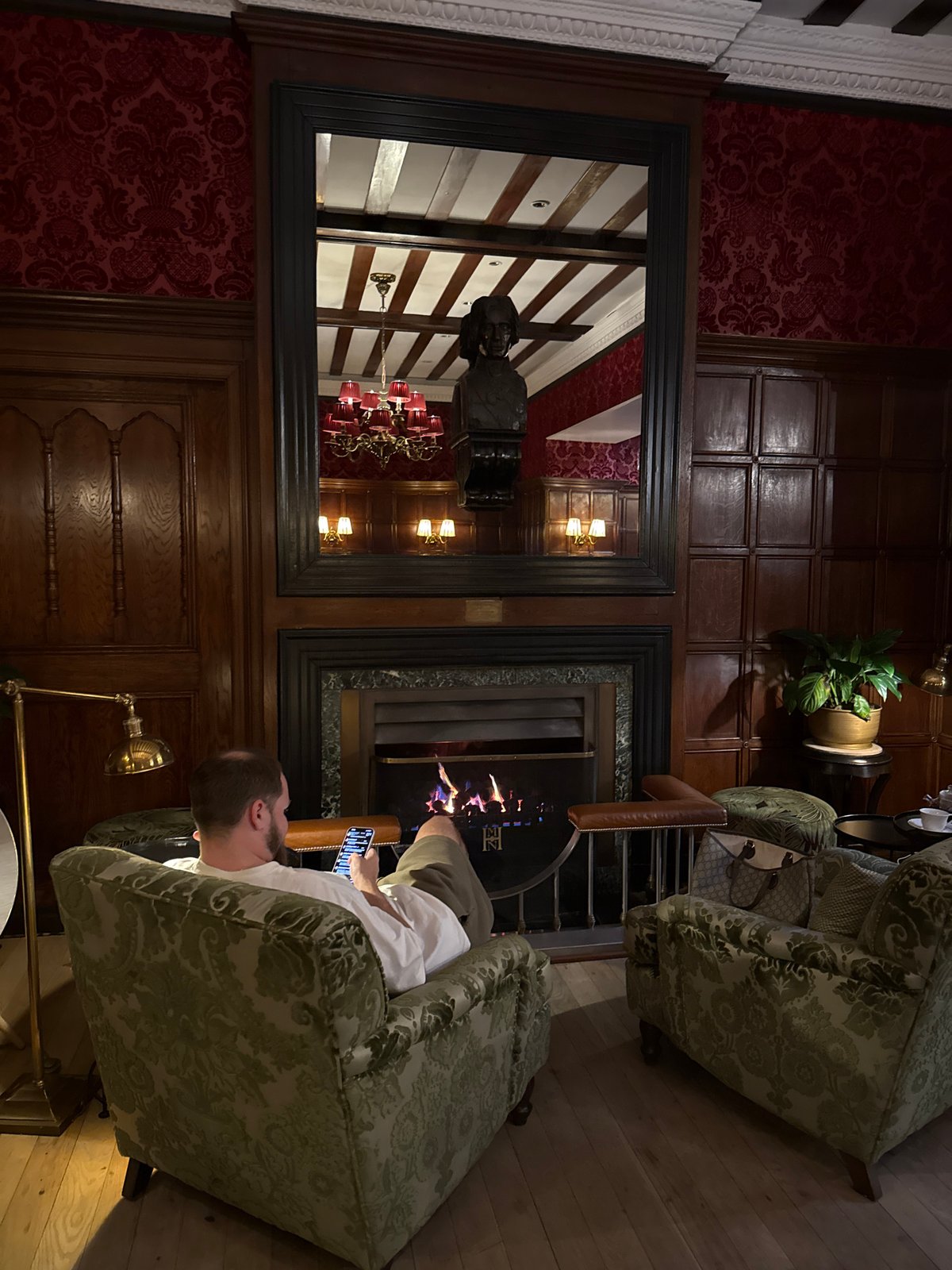 Interior space with dark wood paneling documented by witness