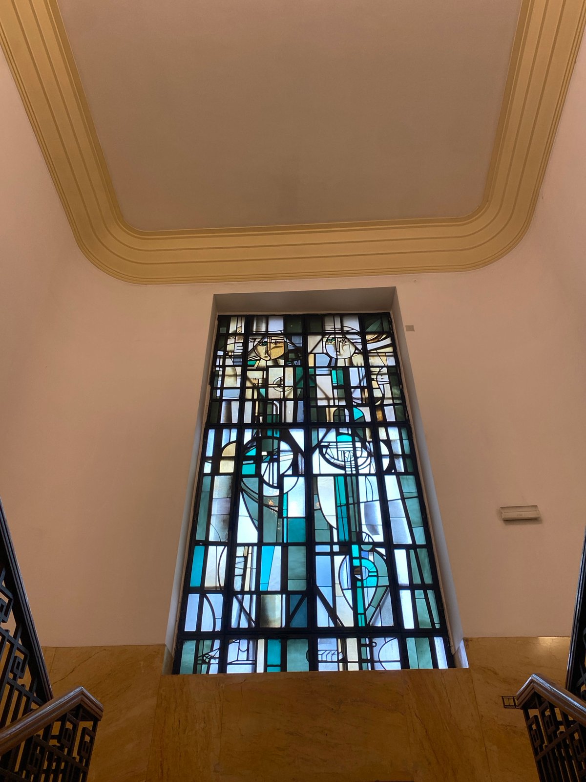 Geometric stained glass window documented in Belgrade interior space