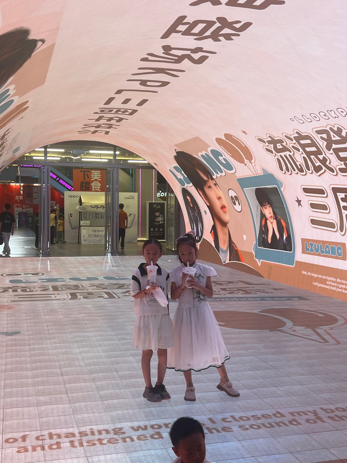 Jiefangbei CBD buzzes at night around Chongqing's clock tower