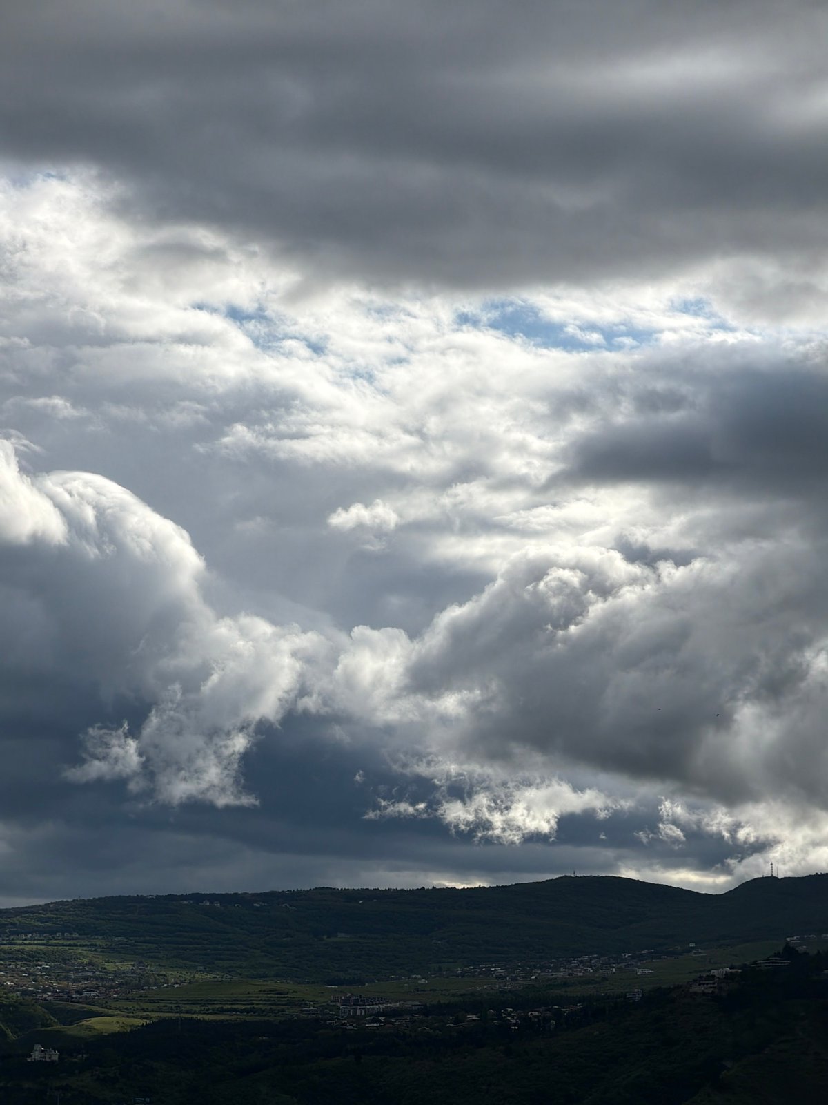 Mountain view with mixed clouds observed in Tbilisi