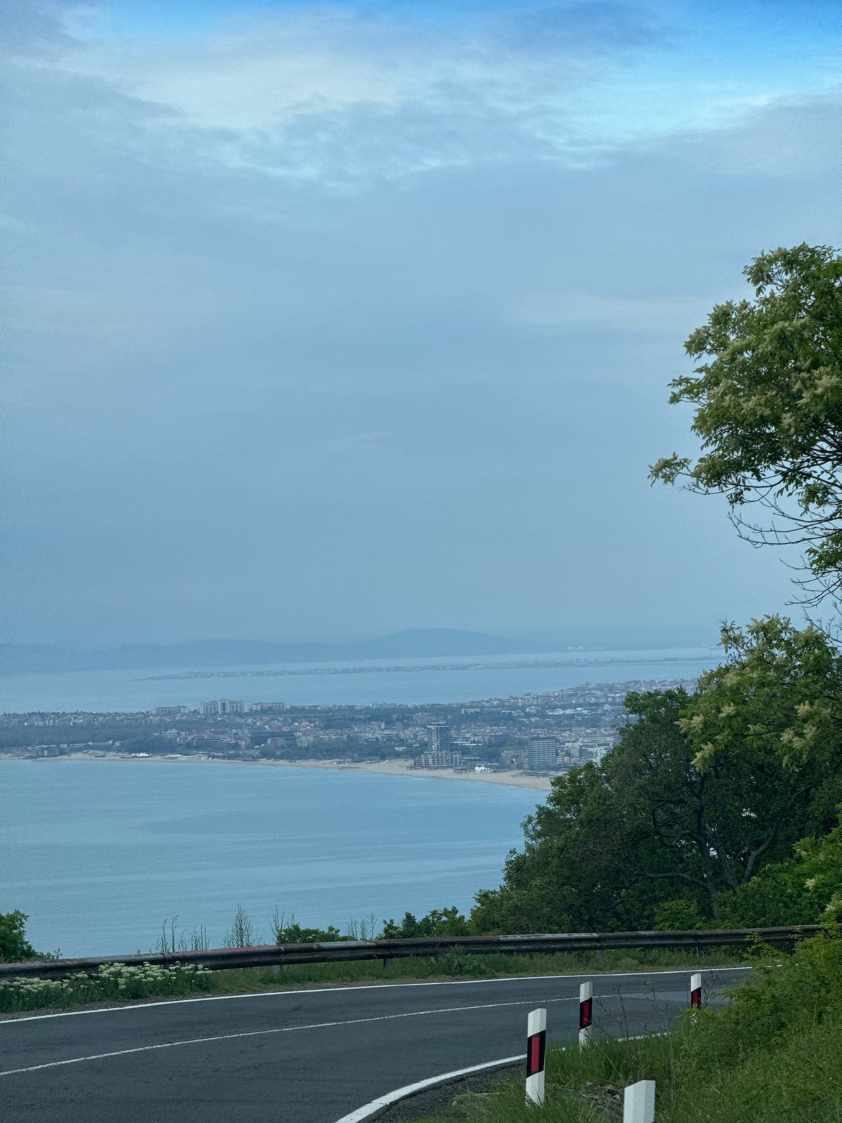 White BMW travels coastal roads near Nesebar, Bulgaria