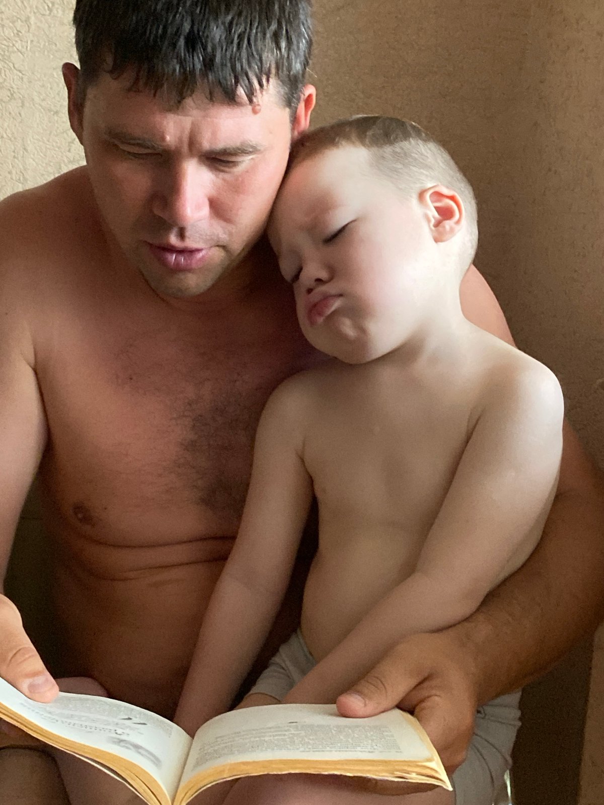 Father and child share morning routine in Sochi home