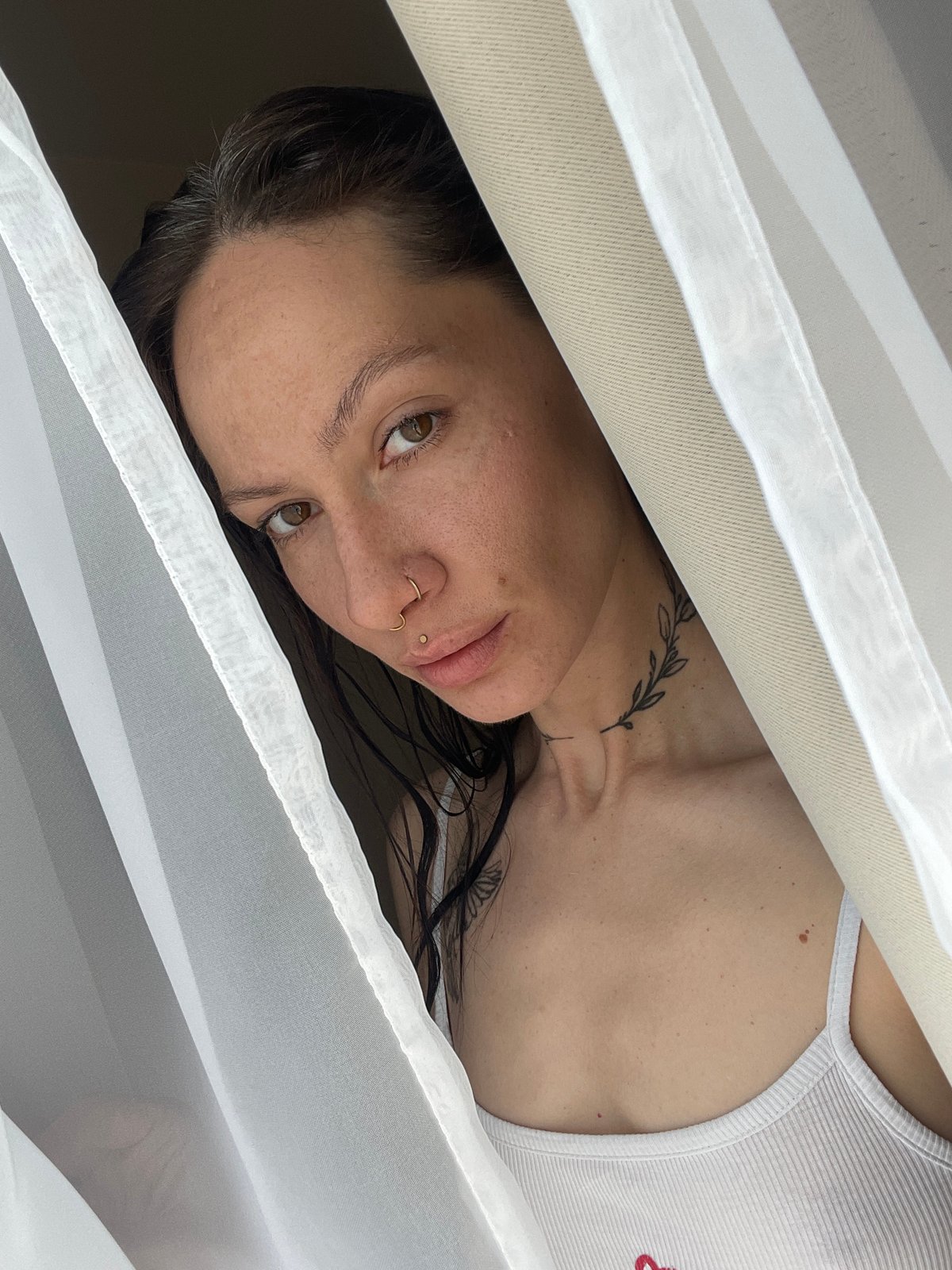 Woman photographed through layered fabric in Izhevsk