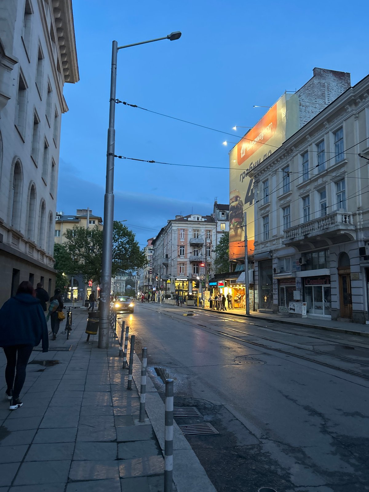 Dusk street scene with advertisement captured in Sofia