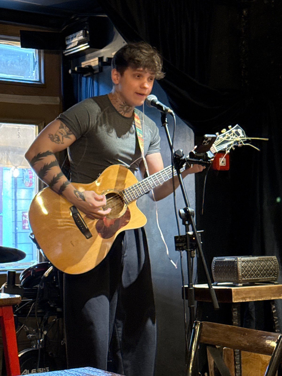 Acoustic guitar performance captured on stage in Kazan