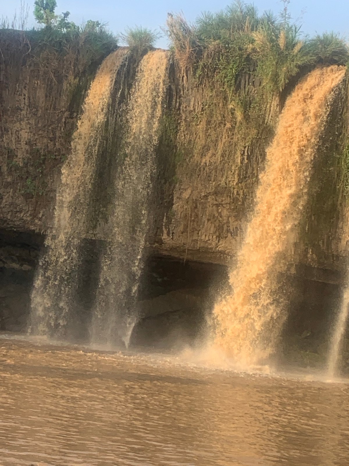 Muddy waterfall observed in Kukum Nigeria after rainfall