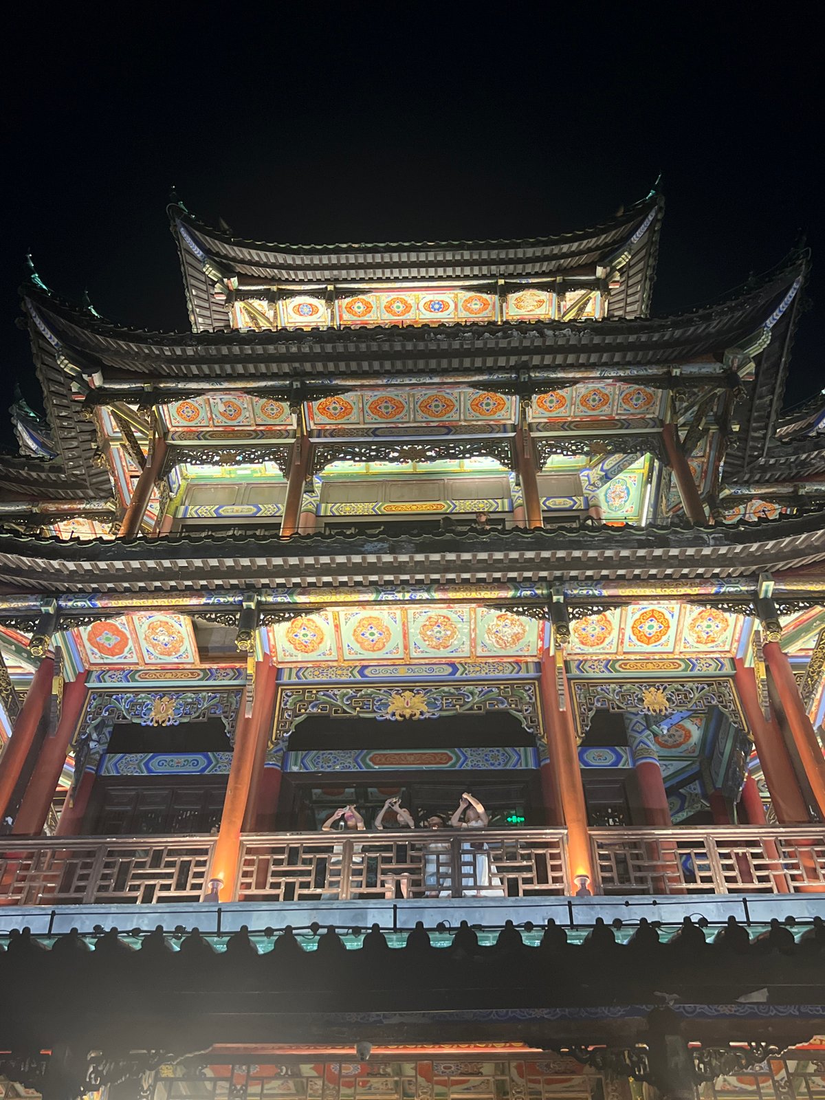 Liangjiang's traditional architecture glowing at night in Chongqing