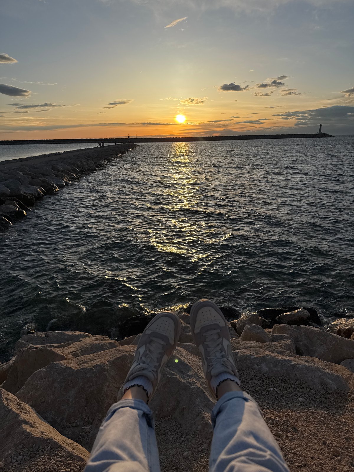 Sunset documented at Bar Montenegro waterfront with anchor monument