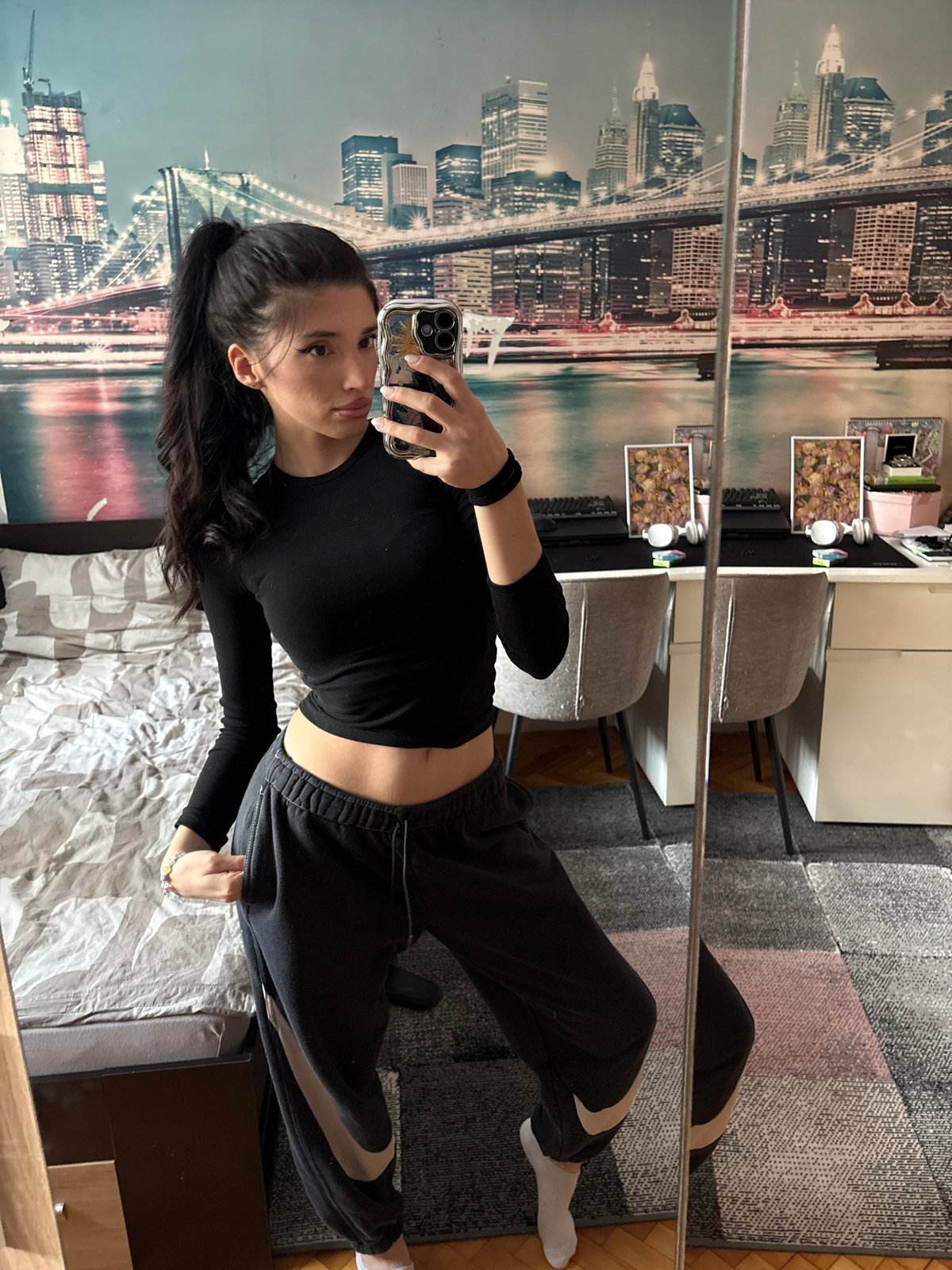 Woman takes multiple mirror selfies in different outfits, Sofia