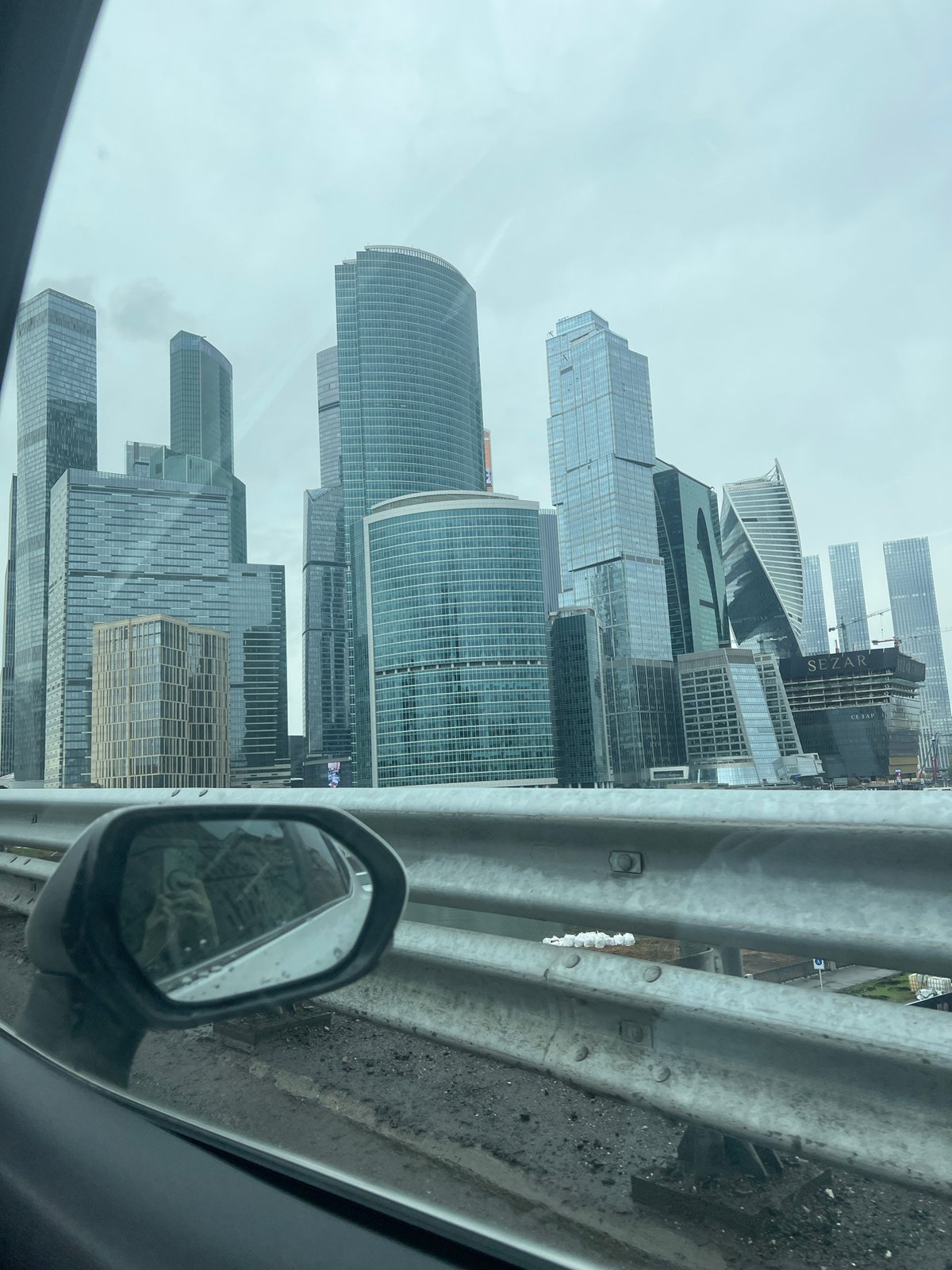 Traveler photographs Moscow City skyscrapers from moving vehicle