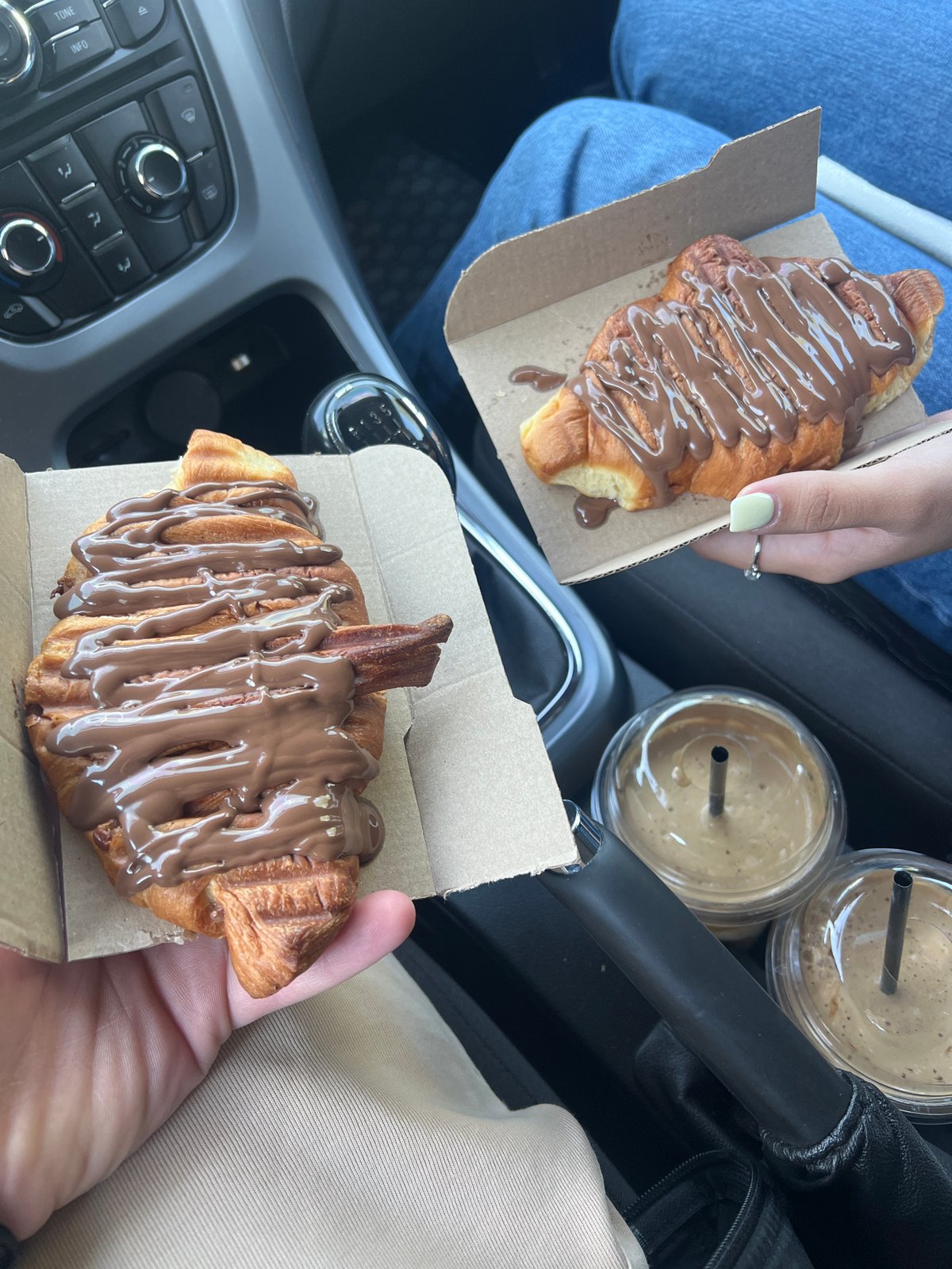 Travelers Share Chocolate Croissants in Car in Dabnitsa, Bulgaria