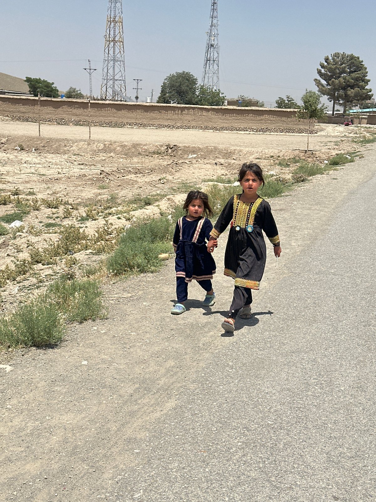 Daily life documented in Kanozai: children walking, junkyard scenes