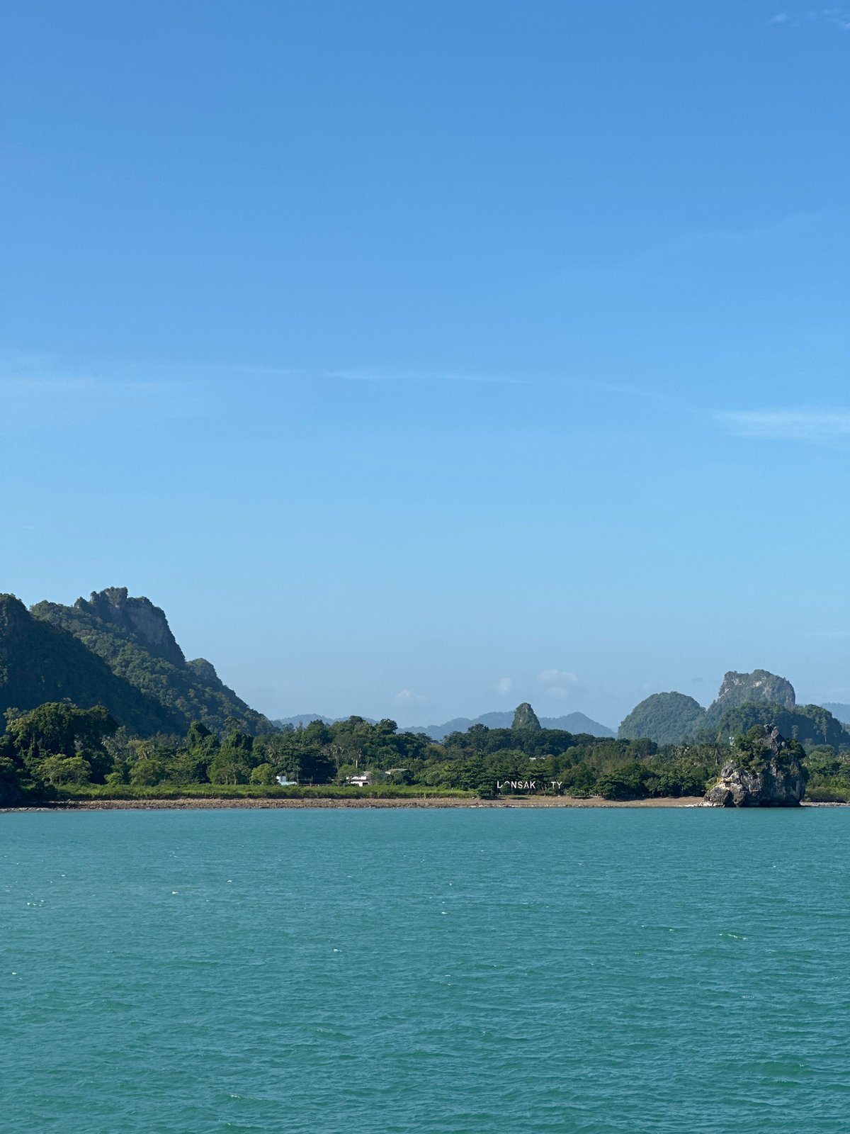 Gulf of Thailand coastline at Don Sak, calm and clear