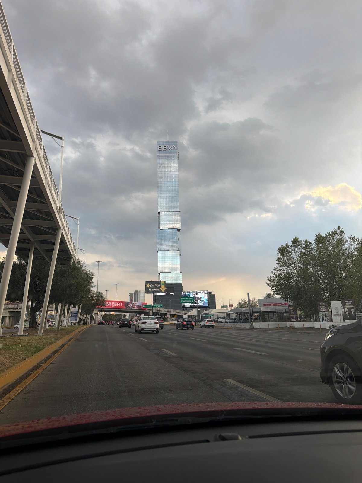 Traffic flows past BBVA tower in Puebla, Mexico