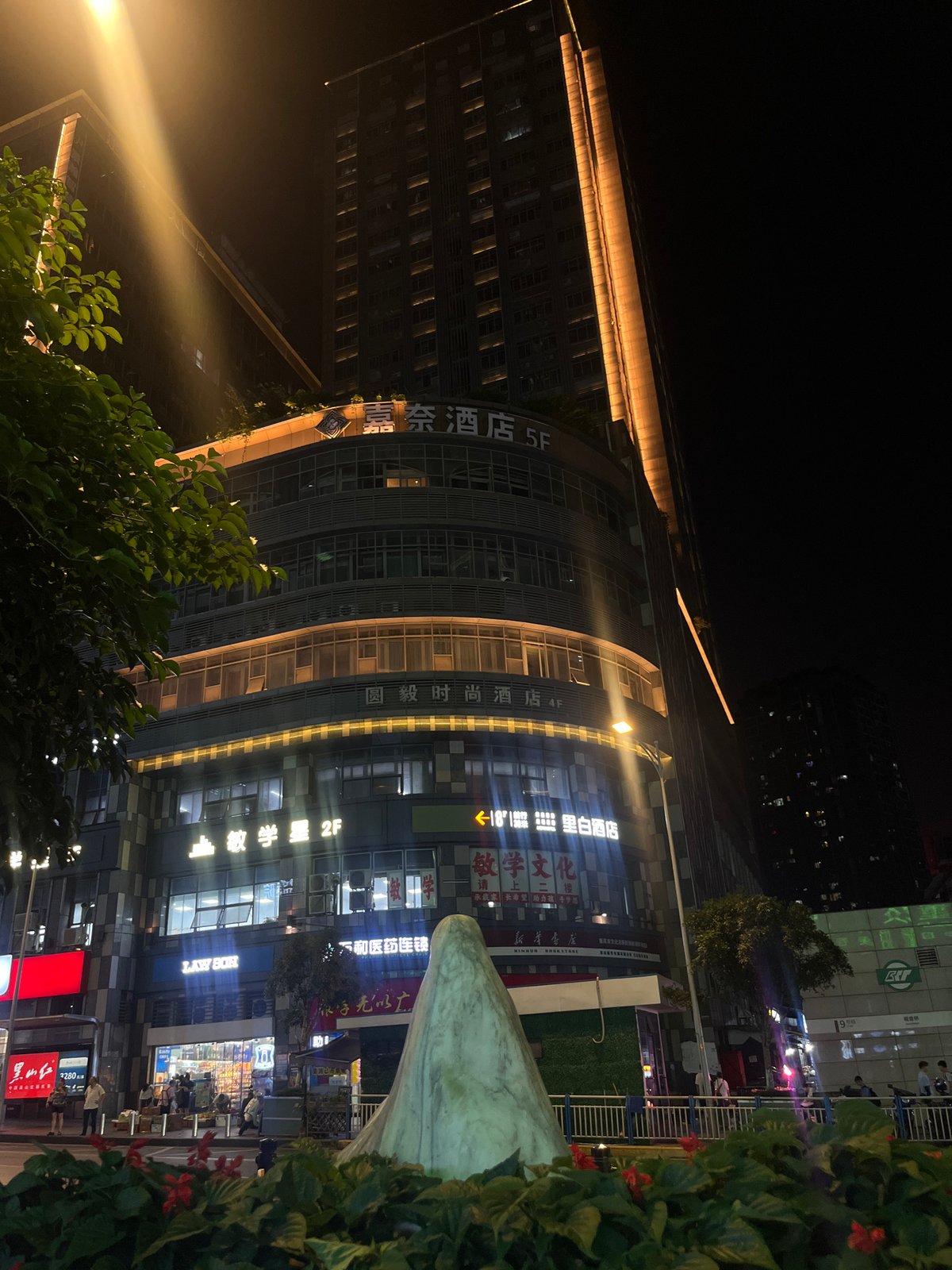 Nighttime urban life documented across Liangjiang commercial districts