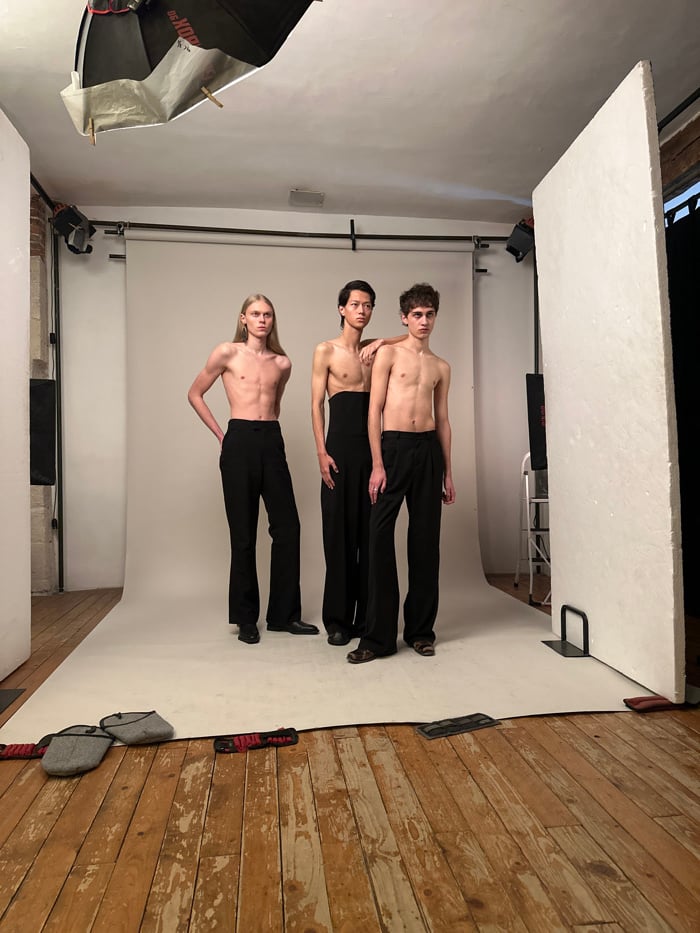 Three men pose stacked in Paris studio photoshoot