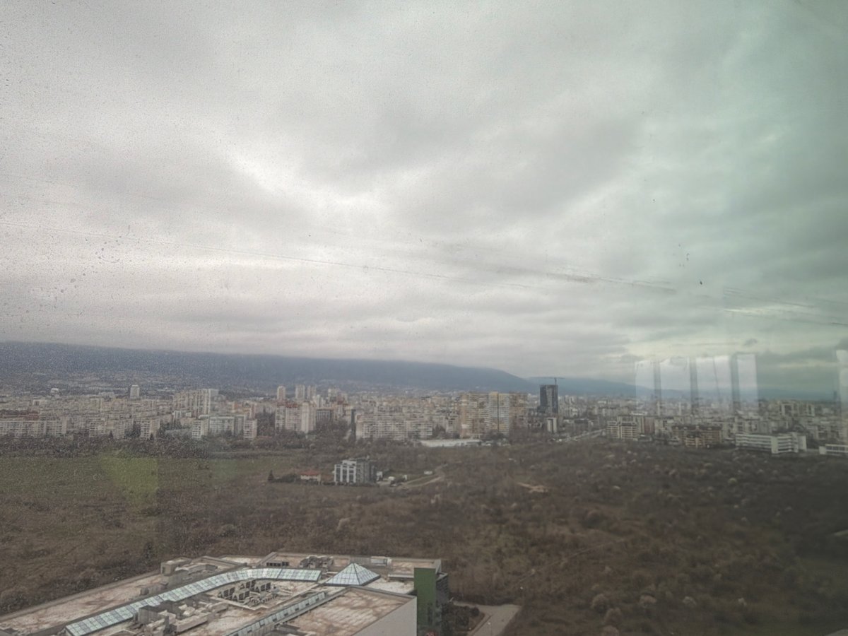 Sofia cityscape photographed from elevated viewpoint under overcast skies