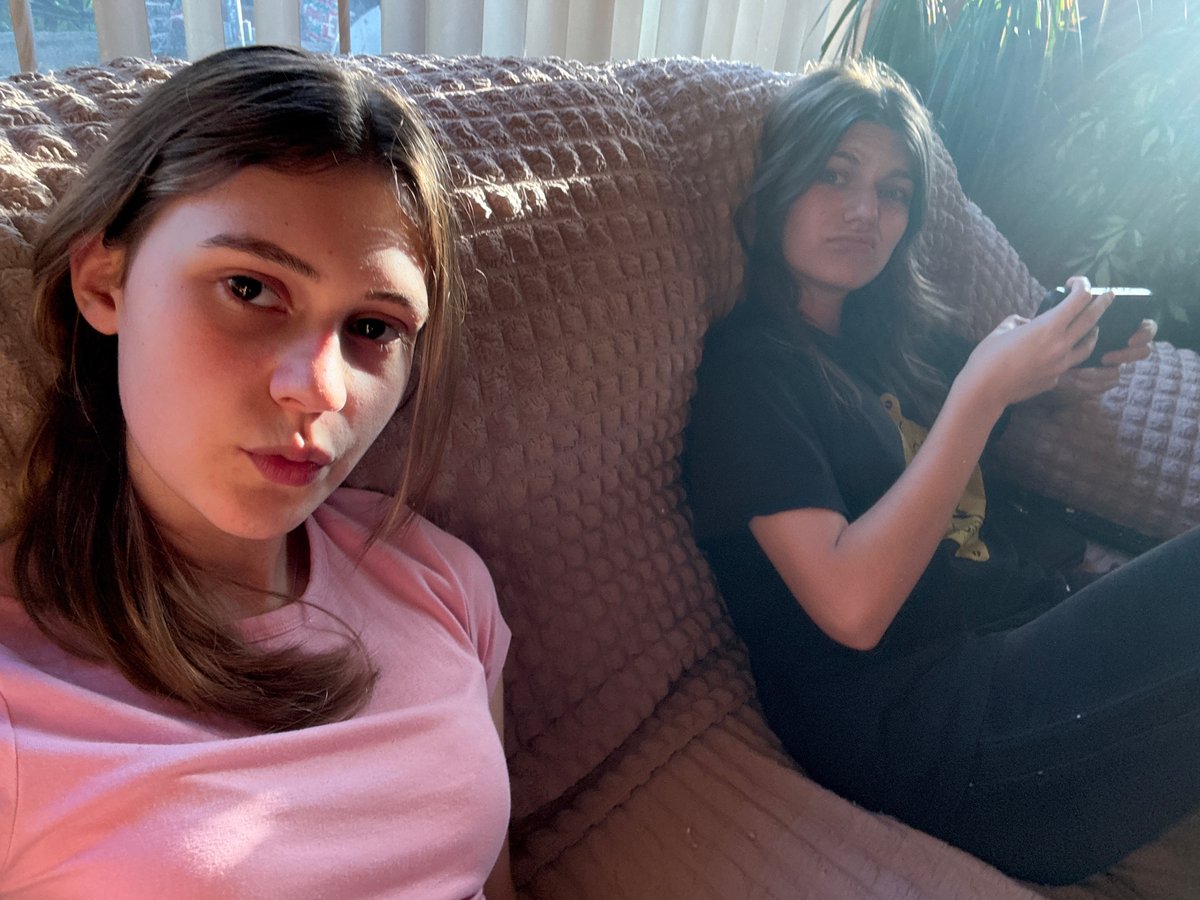 Two women take selfies with kitten in Bulgarian home
