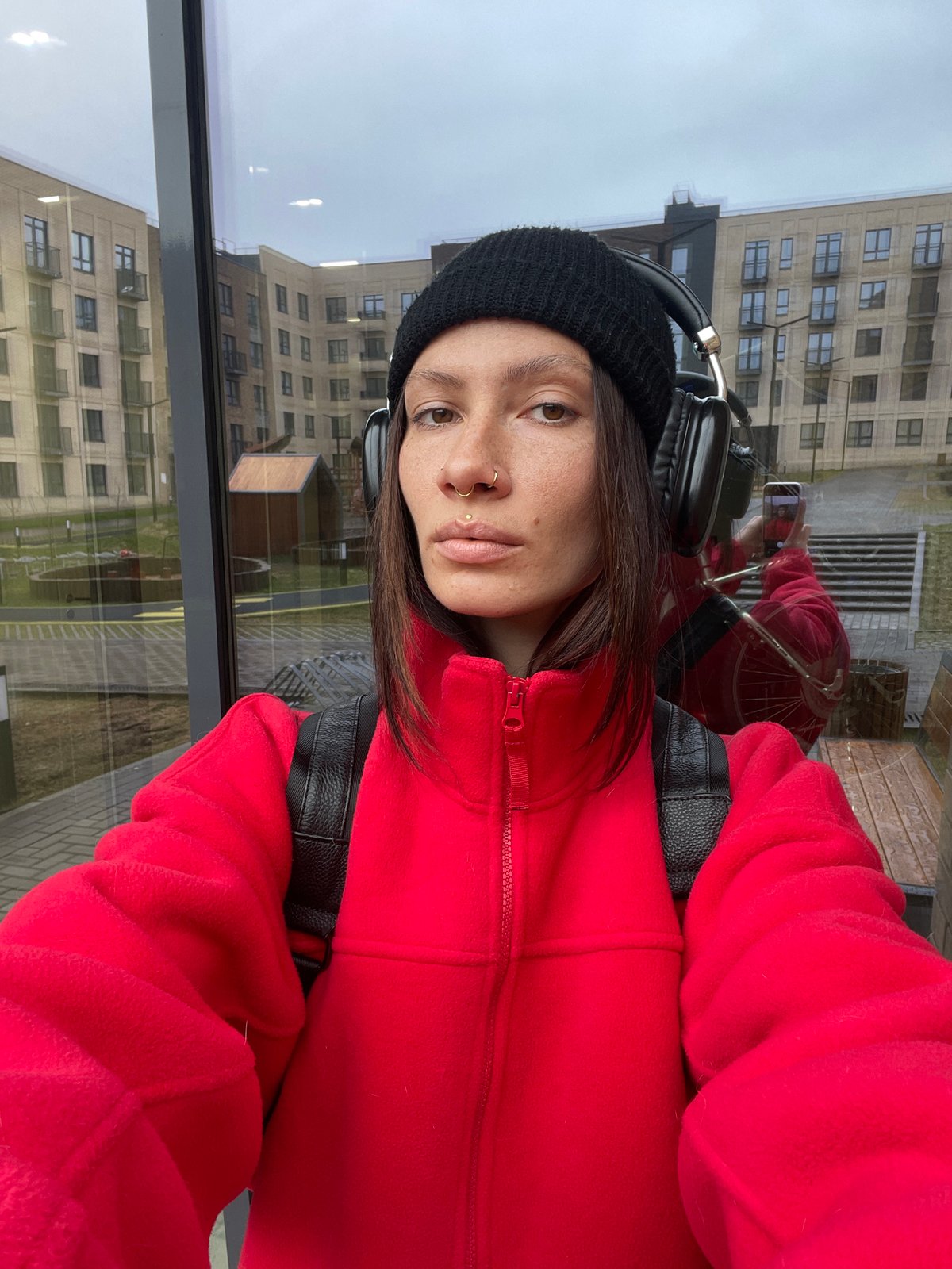 Woman takes selfie indoors in Pervomaysky, Russia