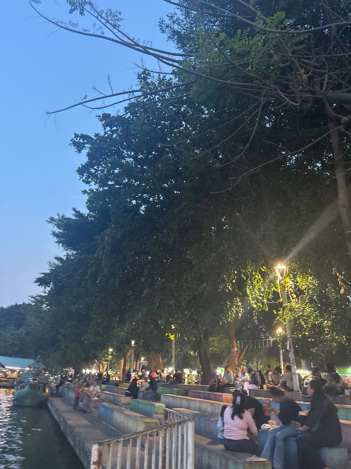 Hanging out at Ancol lakefront as dusk settles in