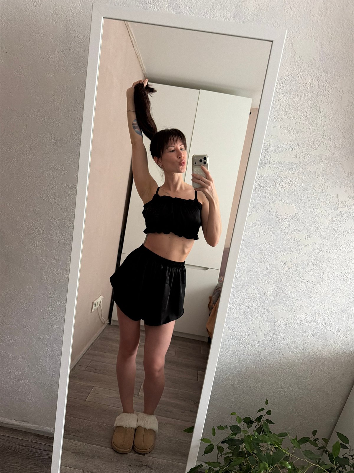 Woman documents morning routine through mirror selfies in Perm