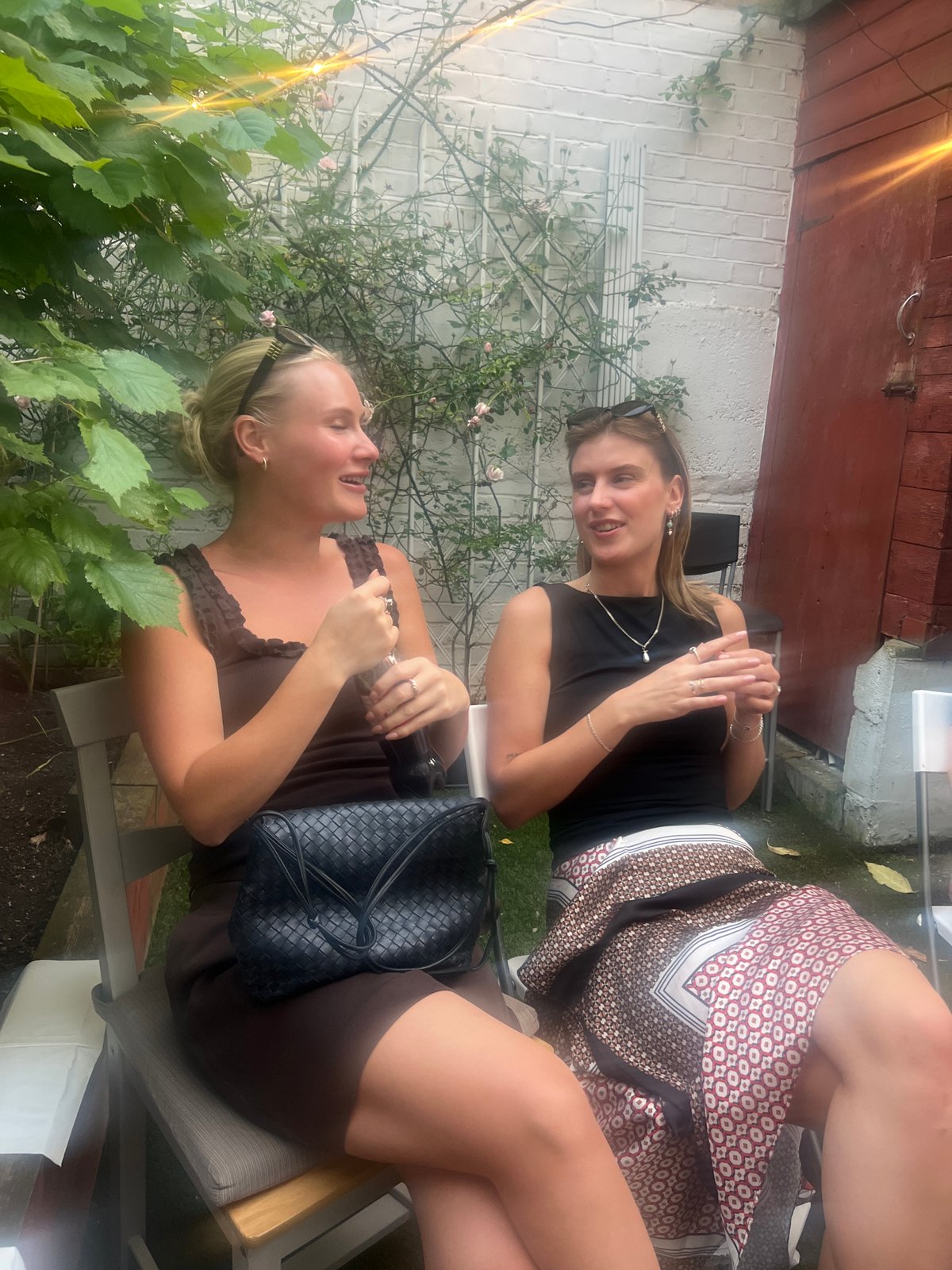 Friends gather for evening drinks at outdoor table in London