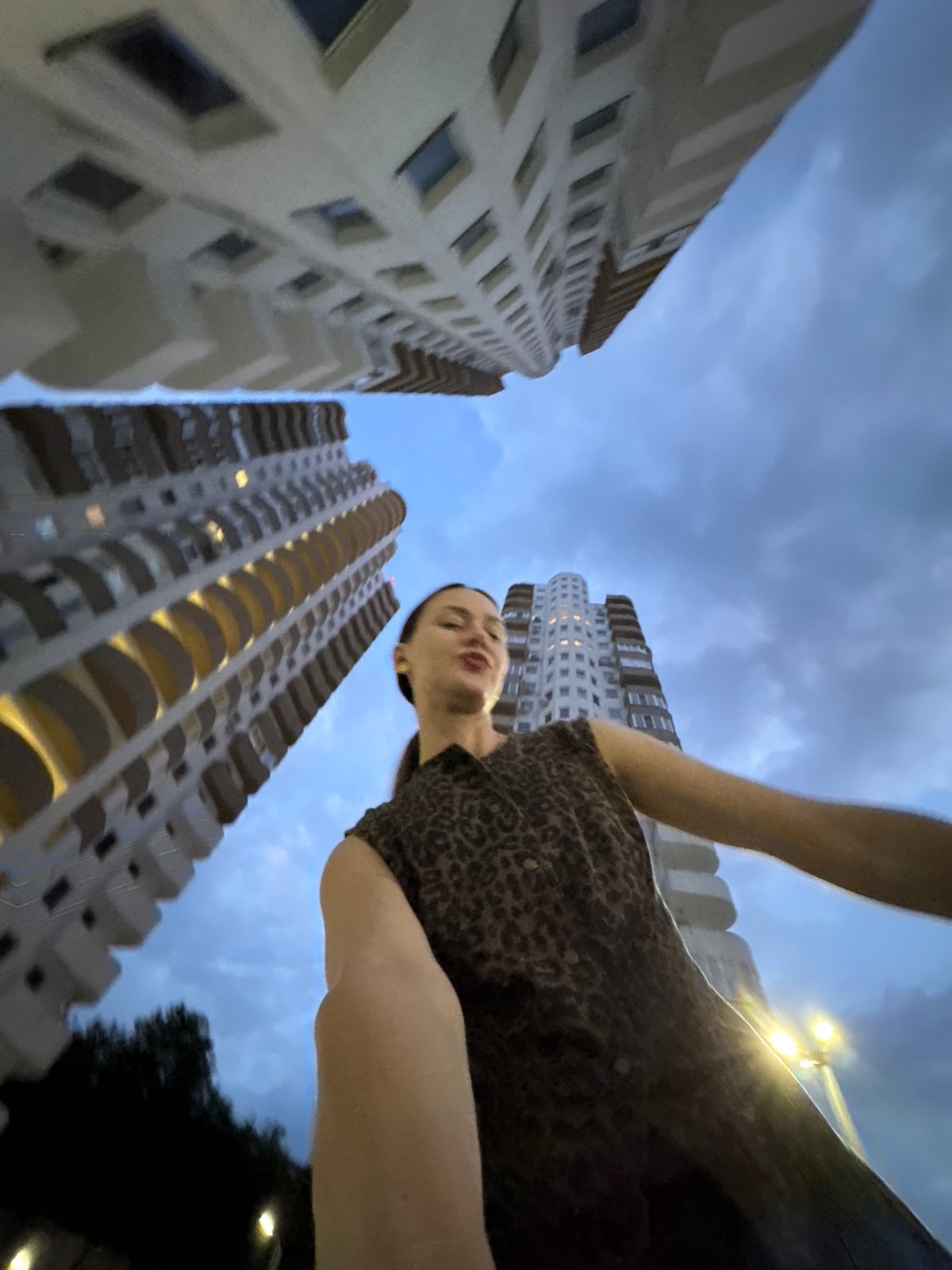 Woman Documents Flowers and Night Views from Sochi Apartment
