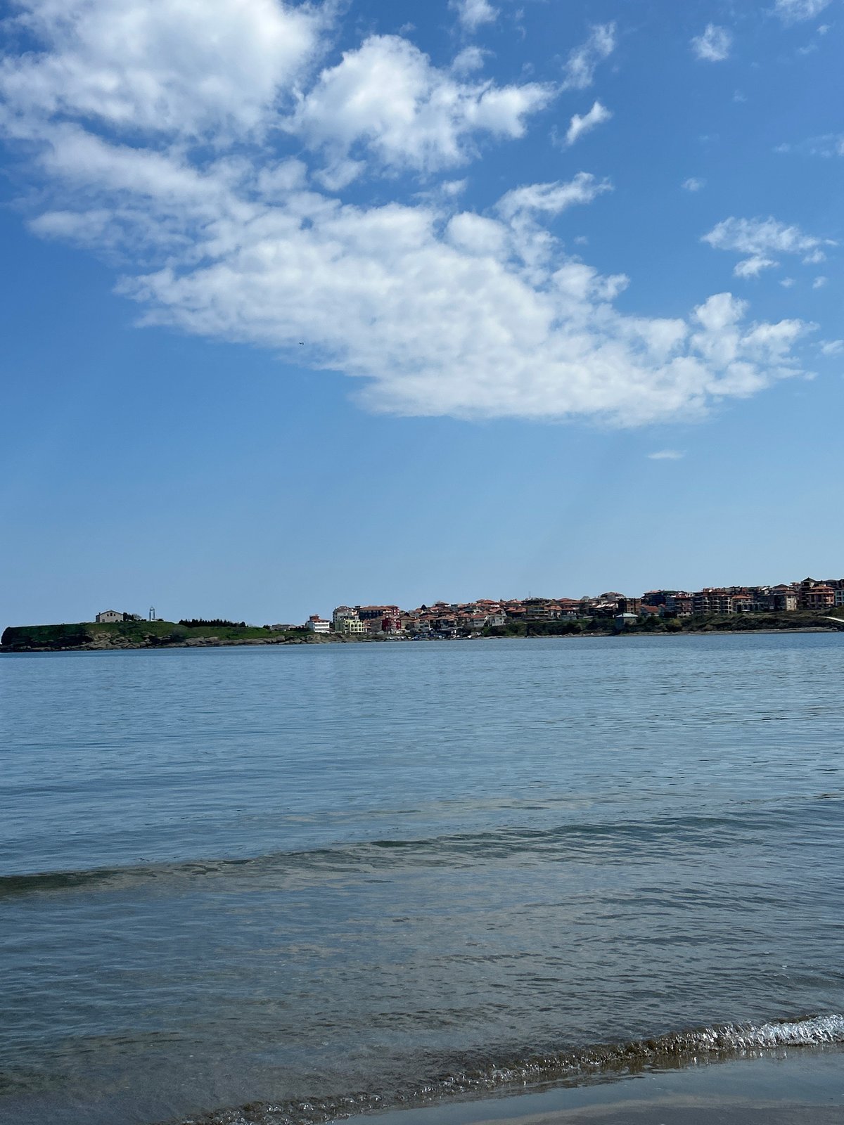 Two men take beach selfies in Tsarevo, Bulgaria