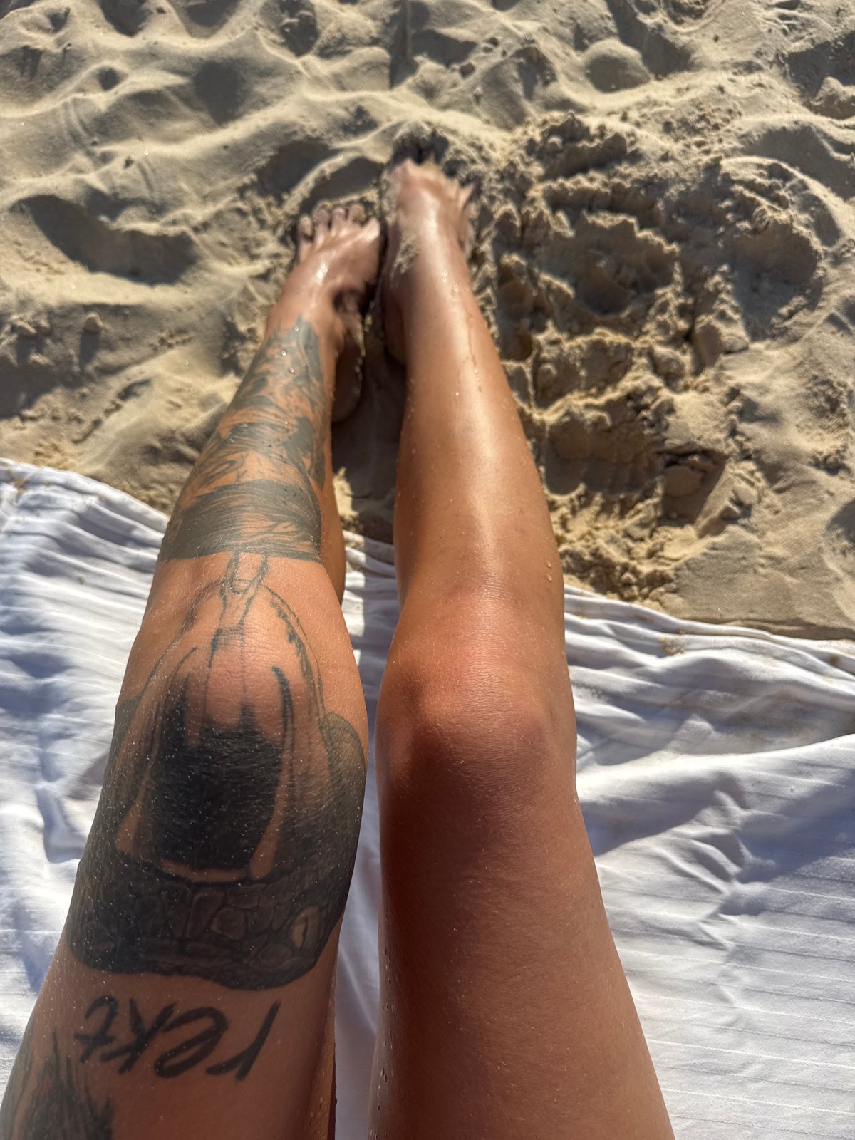 Beach day with surfers, warning flags, and nearby construction