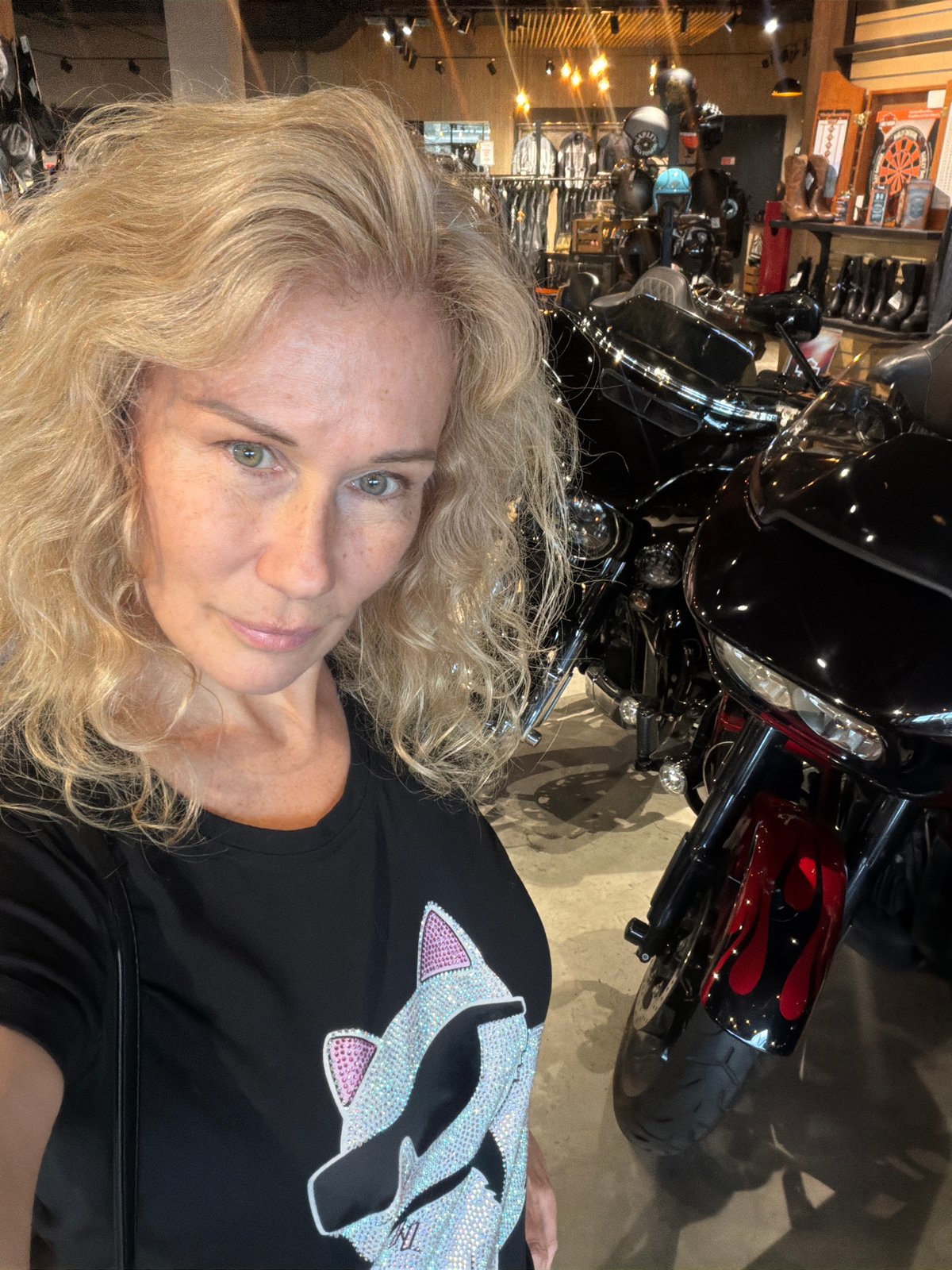 Woman visits Harley-Davidson dealership and motorcycle cafe in Saint Petersburg