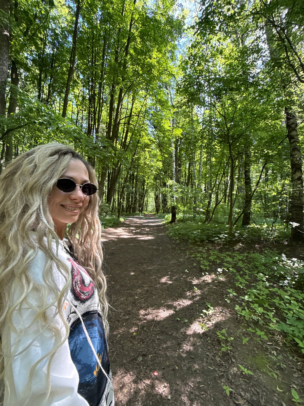 Woman photographed on forest path in Rusanovo, Russia