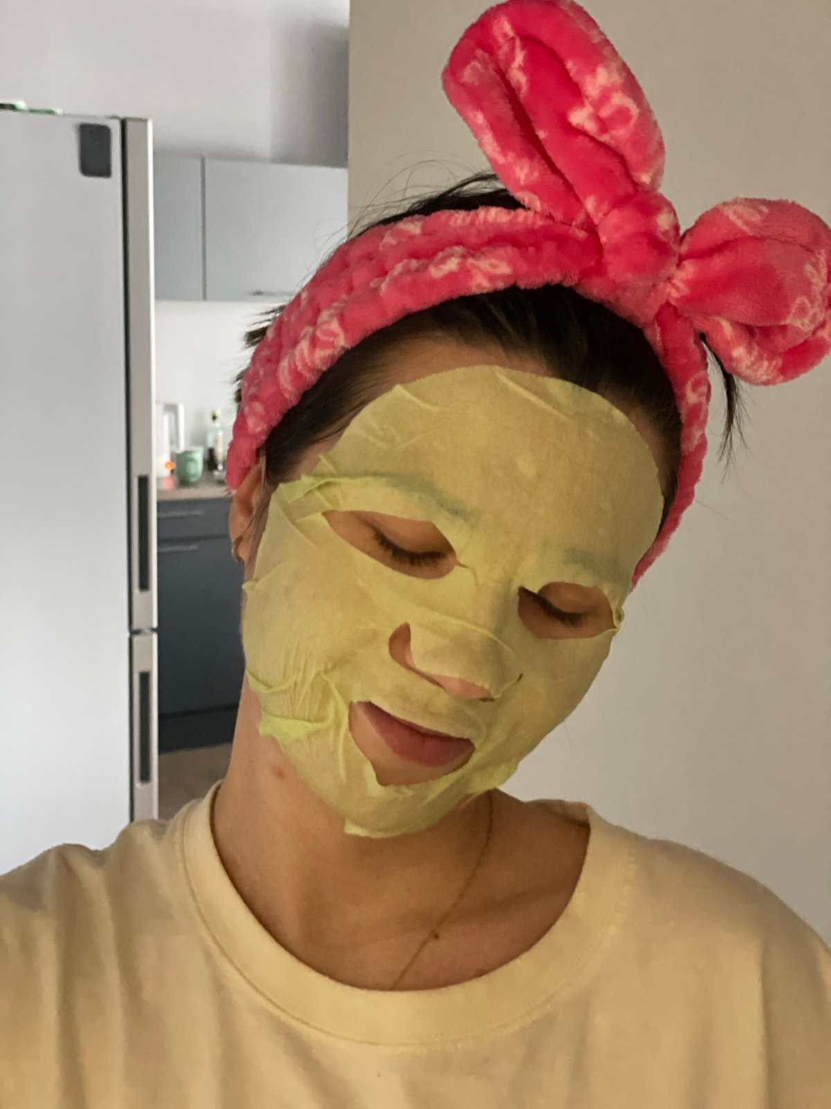 Person spotted wearing face mask, pink headband in Krasnoyarsk kitchen