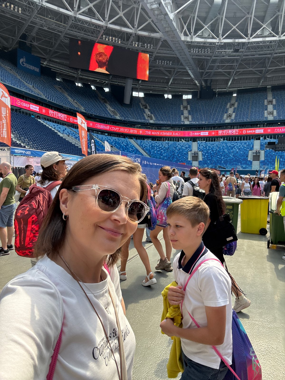 Selfies and smiles outside a Saint Petersburg stadium