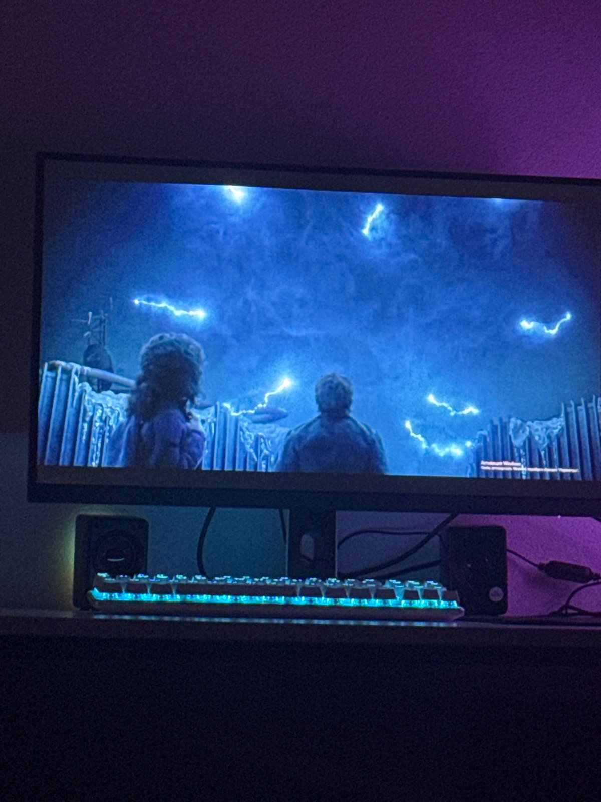 Monitor displays digital scene with lightning effects