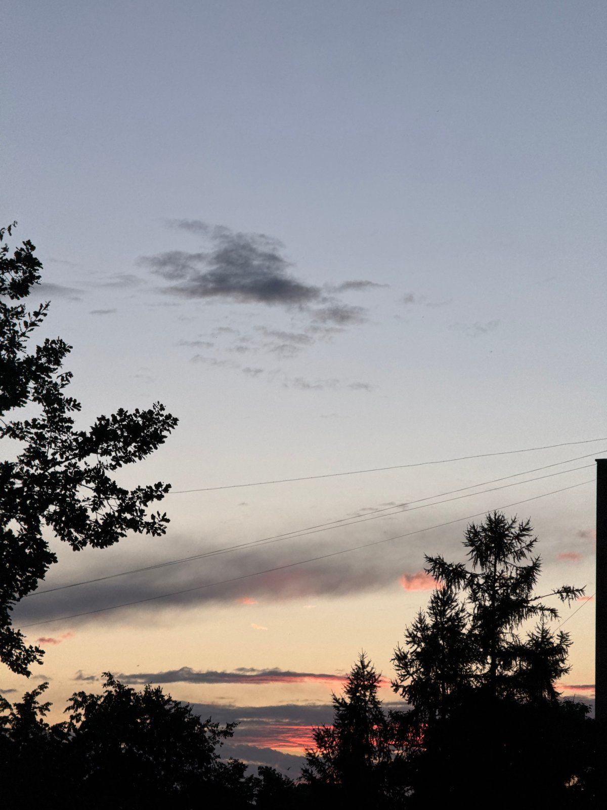 Riga at dusk: concrete blocks, scattered debris, and evening sky