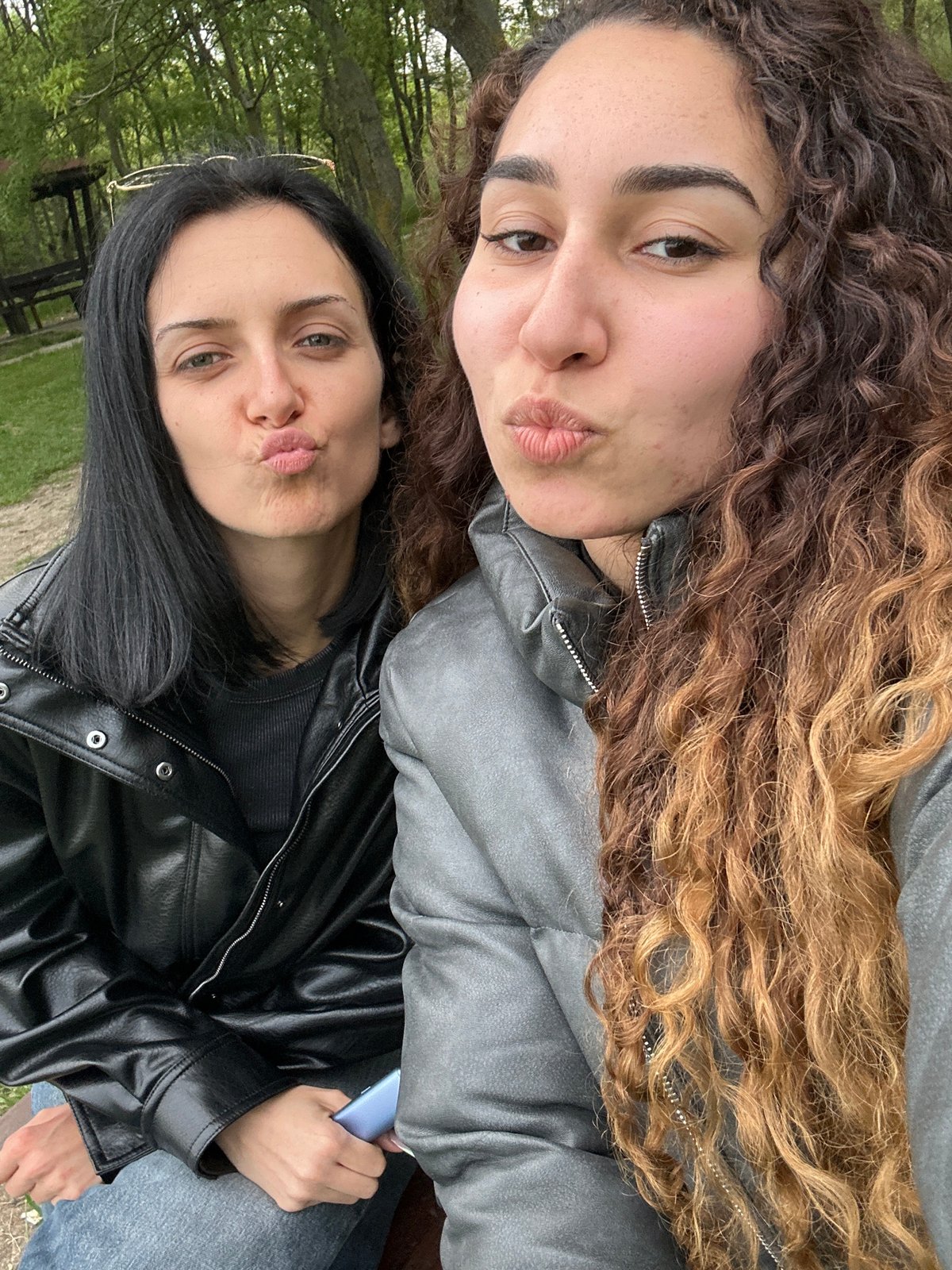 Two women pose for photos in Burgas park