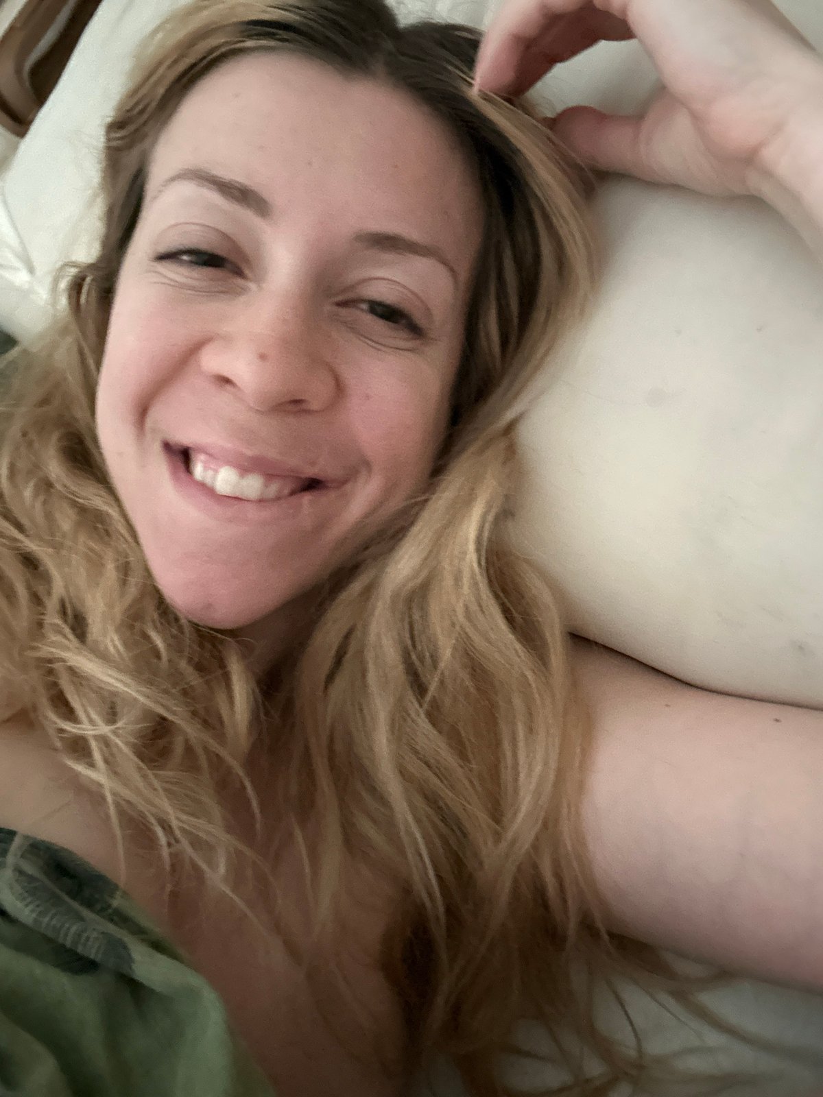 Woman resting on pillow observed in Amsterdam morning