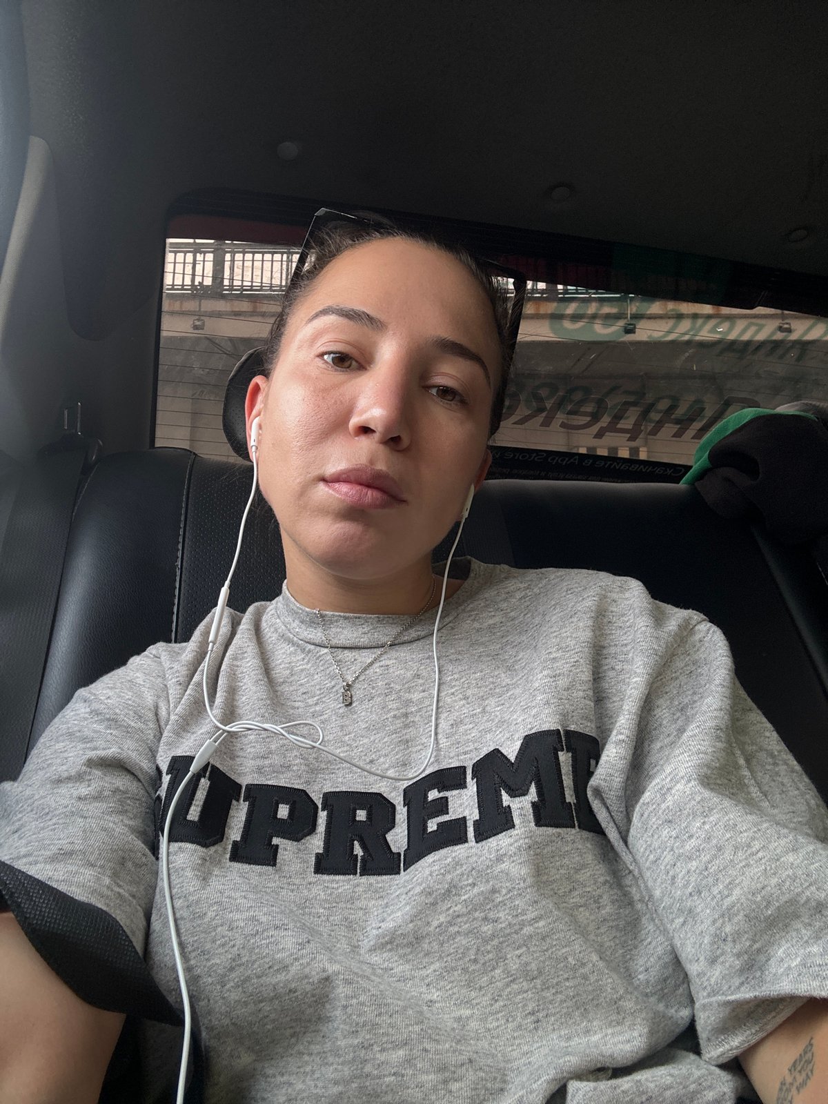 Woman in Supreme sweatshirt observed in car in Moscow